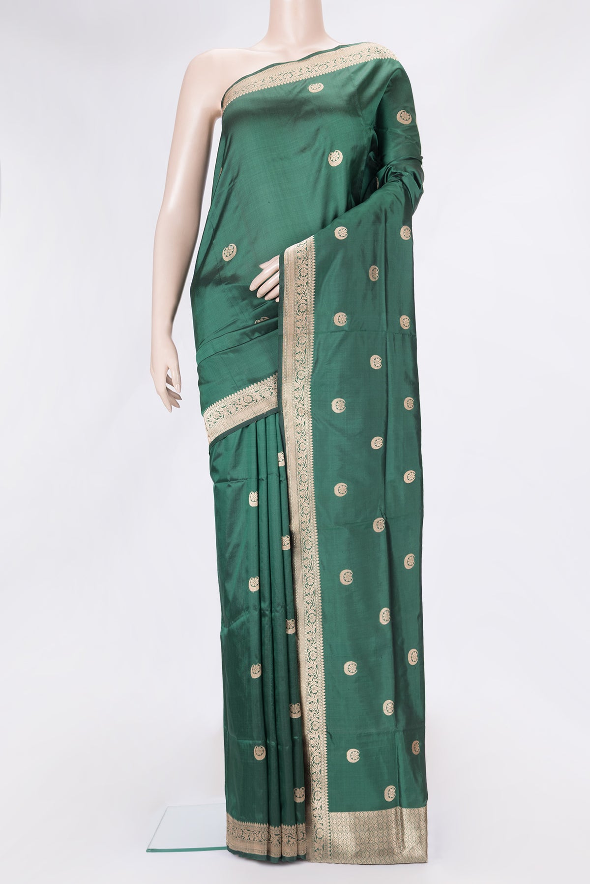 Bottle Green Dual Tone Banarasi Silk Saree with Zari Butta on the body and Zari Border.  displayed on a mannequin