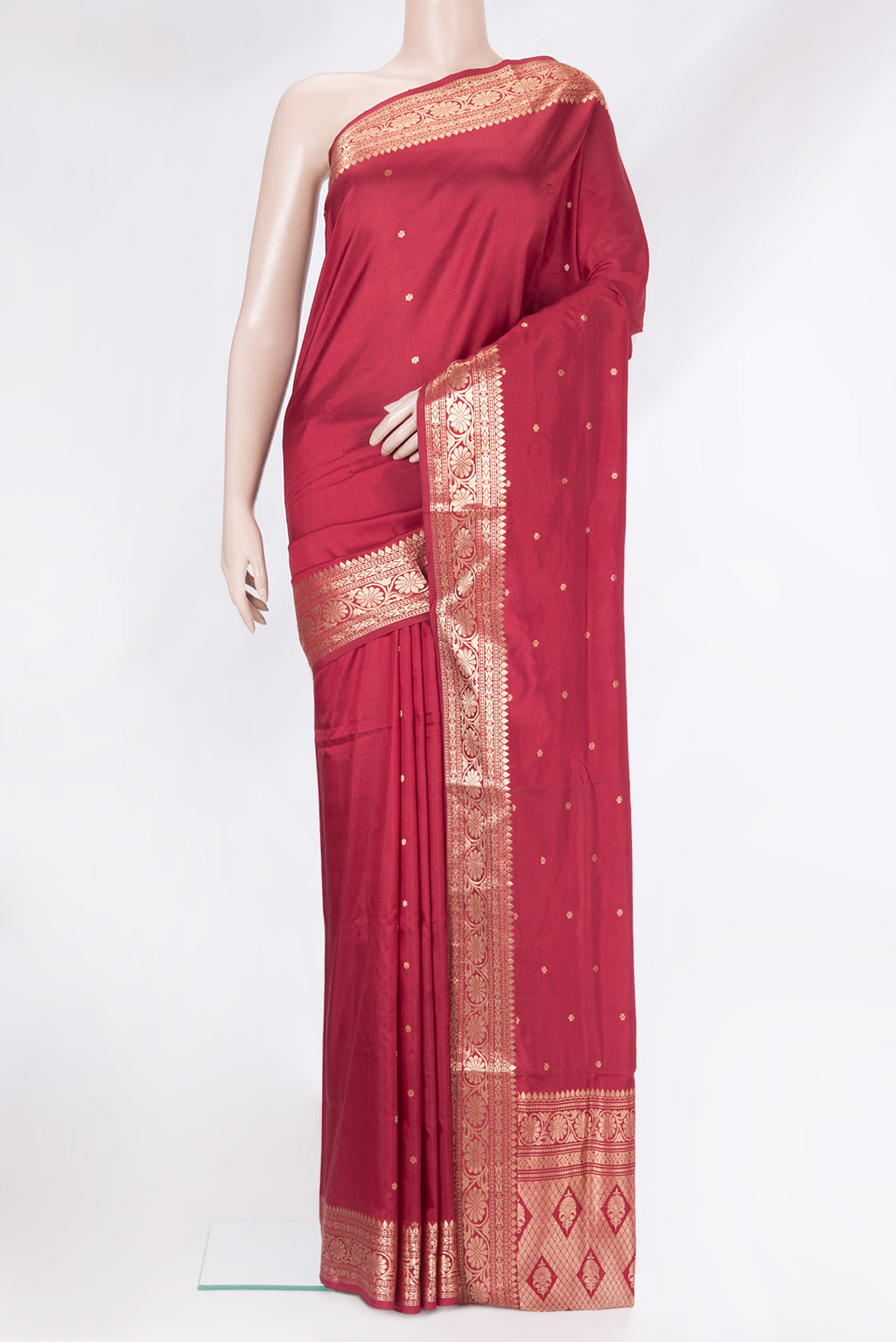 Maroon Banarasi Katan Silk Saree with Zari Butta on the body and Zari Border.  displayed on a mannequin