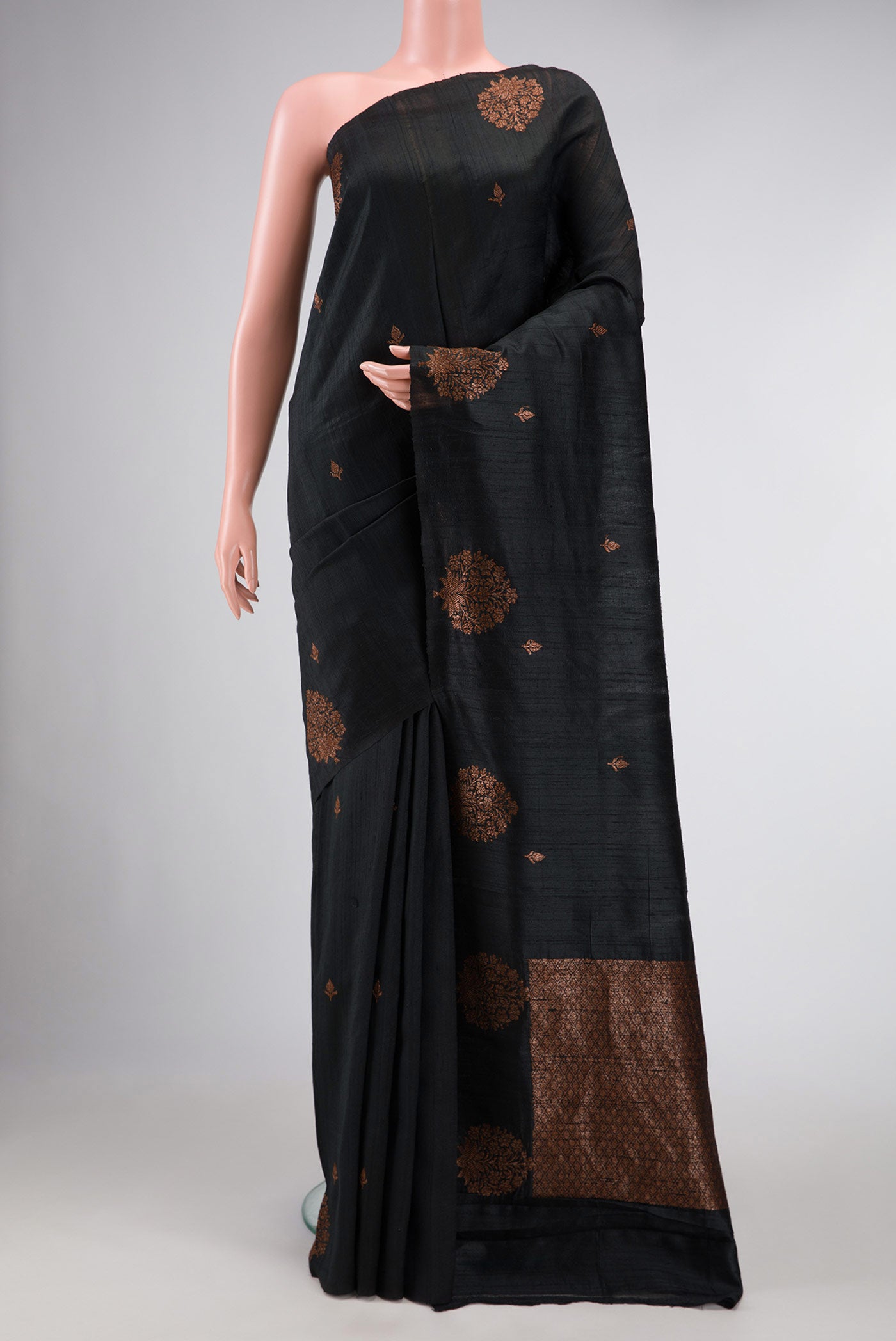Black Banarasi Tussar Silk Saree with Zari Butta on the body and Without Border displayed on a mannequin