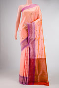 Peach Banarasi Tussar Silk Saree with Zari And Thread Butta on the body and Zari And Thread Border displayed on a mannequin