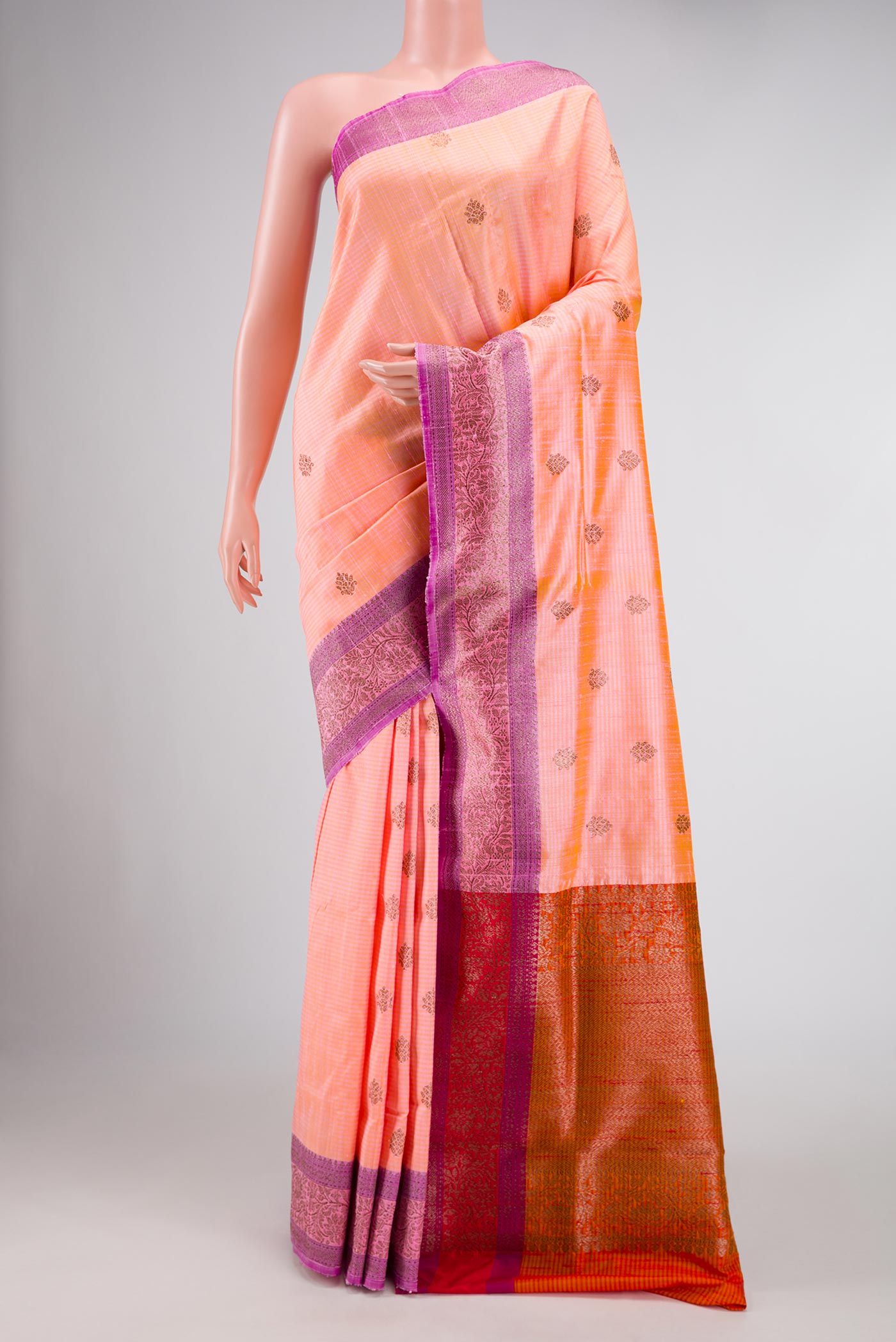 Peach Banarasi Tussar Silk Saree with Zari And Thread Butta on the body and Zari And Thread Border displayed on a mannequin