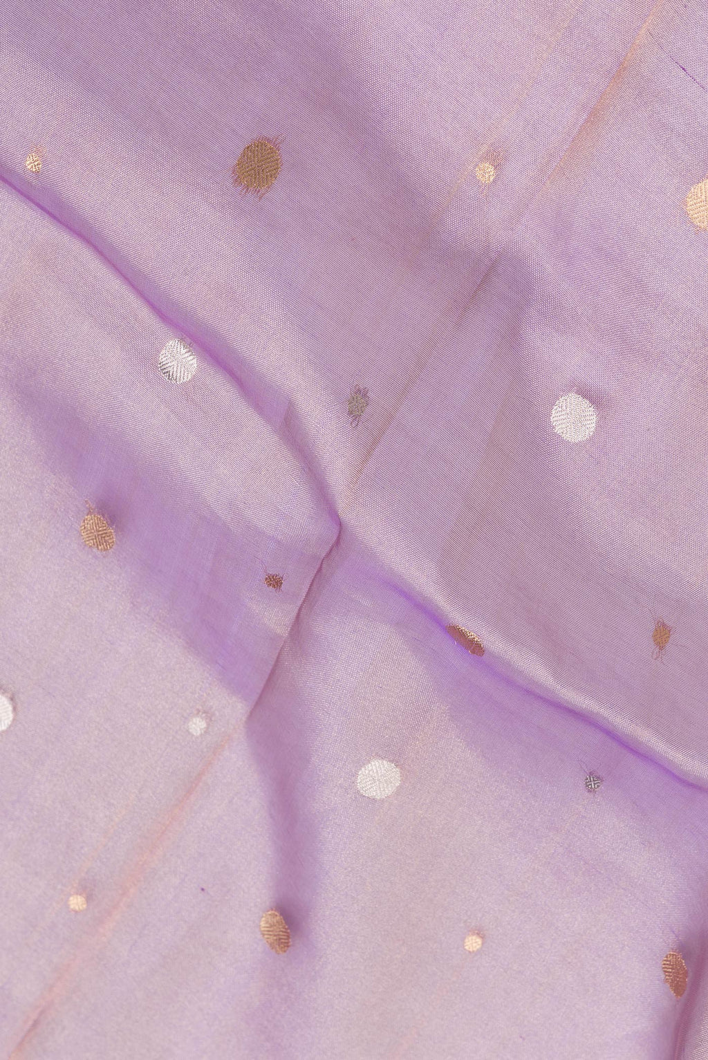 Close up of Lavender Dual Tone Organza Silk Saree with Zari Butta on the body and Zari Border.  displaying folds