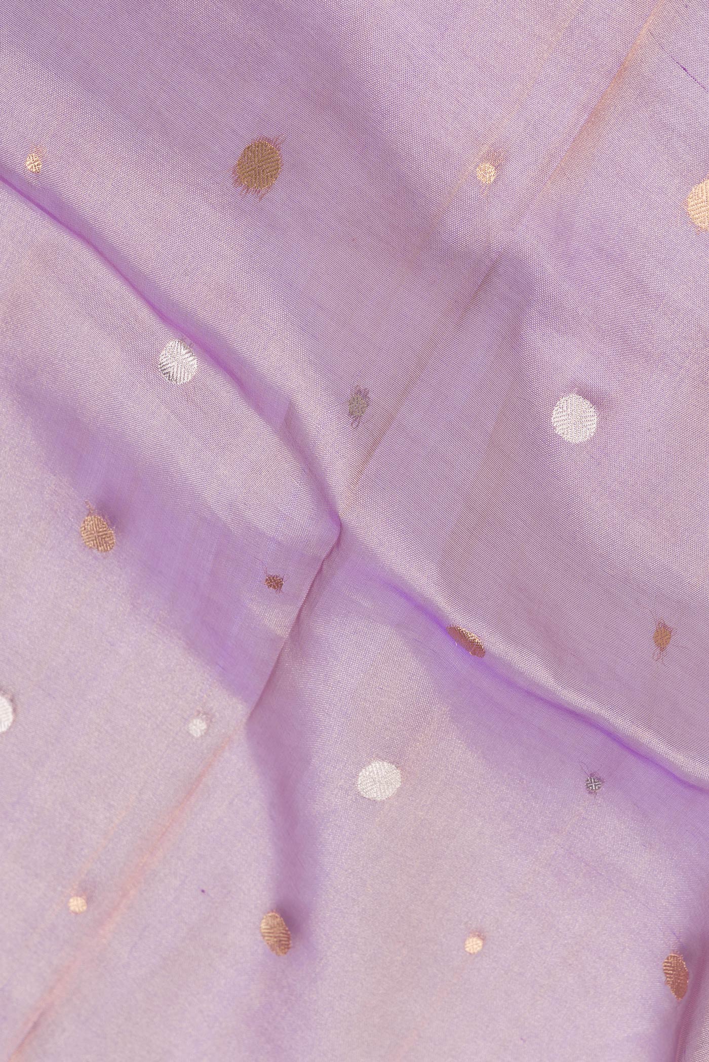 Close up of Lavender Dual Tone Organza Silk Saree with Zari Butta on the body and Zari Border.  displaying folds
