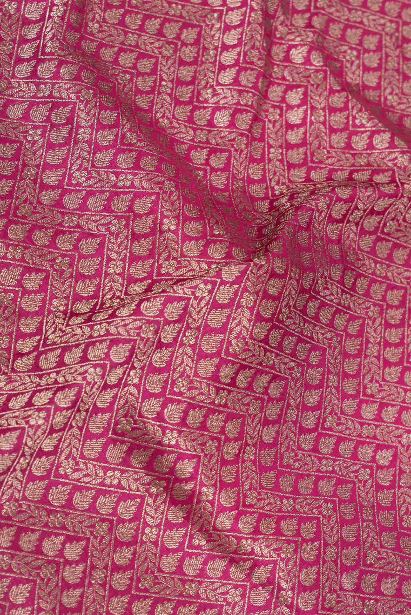 Close up of Dark Pink Dual Tone Banarasi Silk Saree with Zari Brocade on the body and Zari Border displaying folds