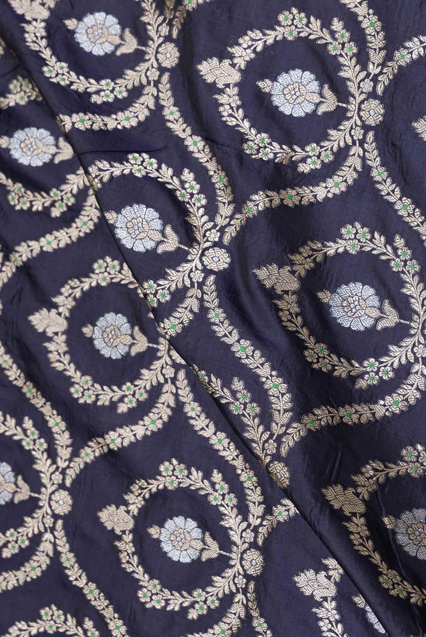 Close up of Navy Blue Dual Tone Banarasi Silk Saree with Zari Brocade on the body and Zari Border displaying folds