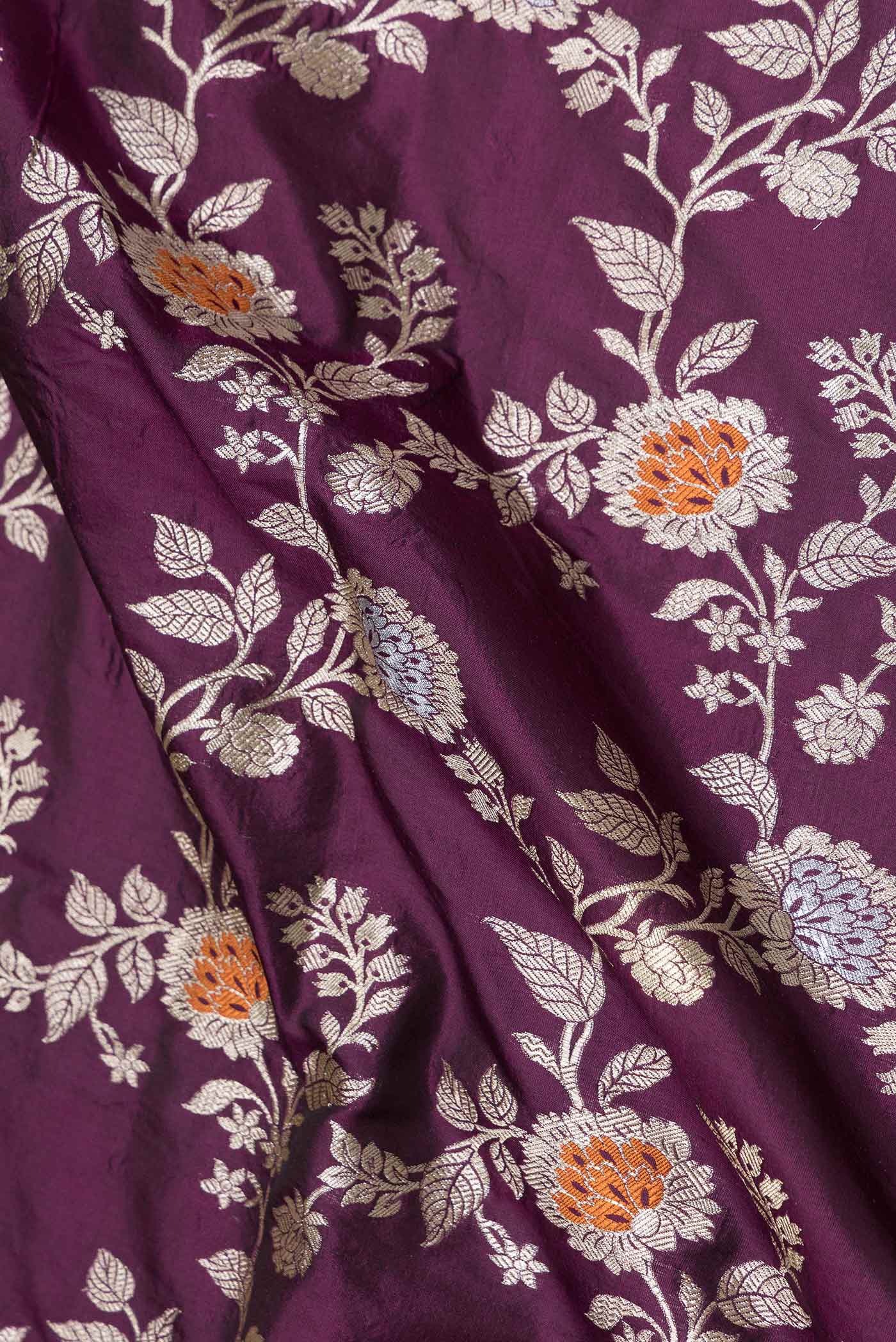Close up of Purple Banarasi Silk Saree with Zari Brocade on the body and Zari Border displaying folds