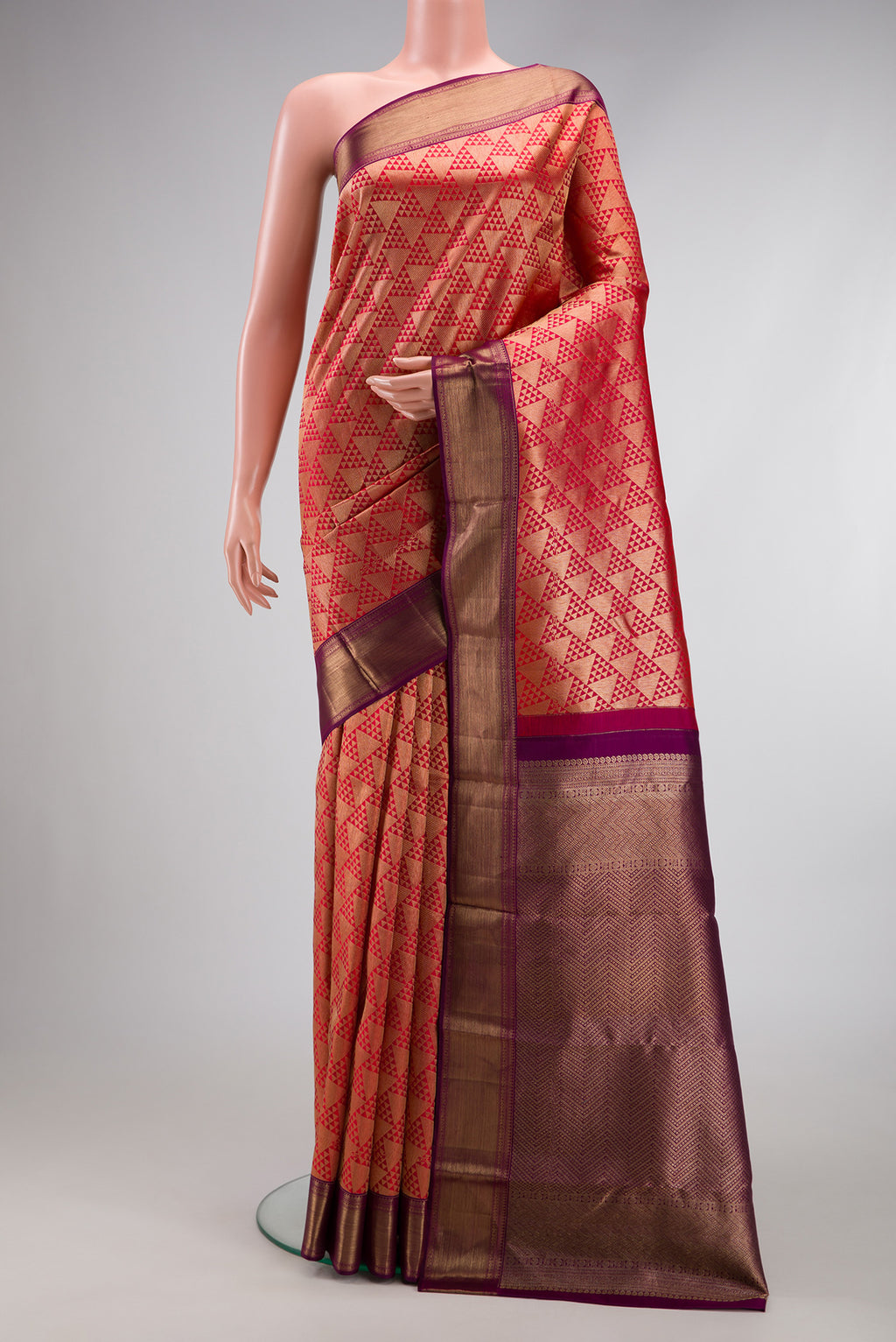 Red Dual Tone Kanchipuram Silk Saree with Zari Brocade on the body and Zari Border.  displayed on a mannequin