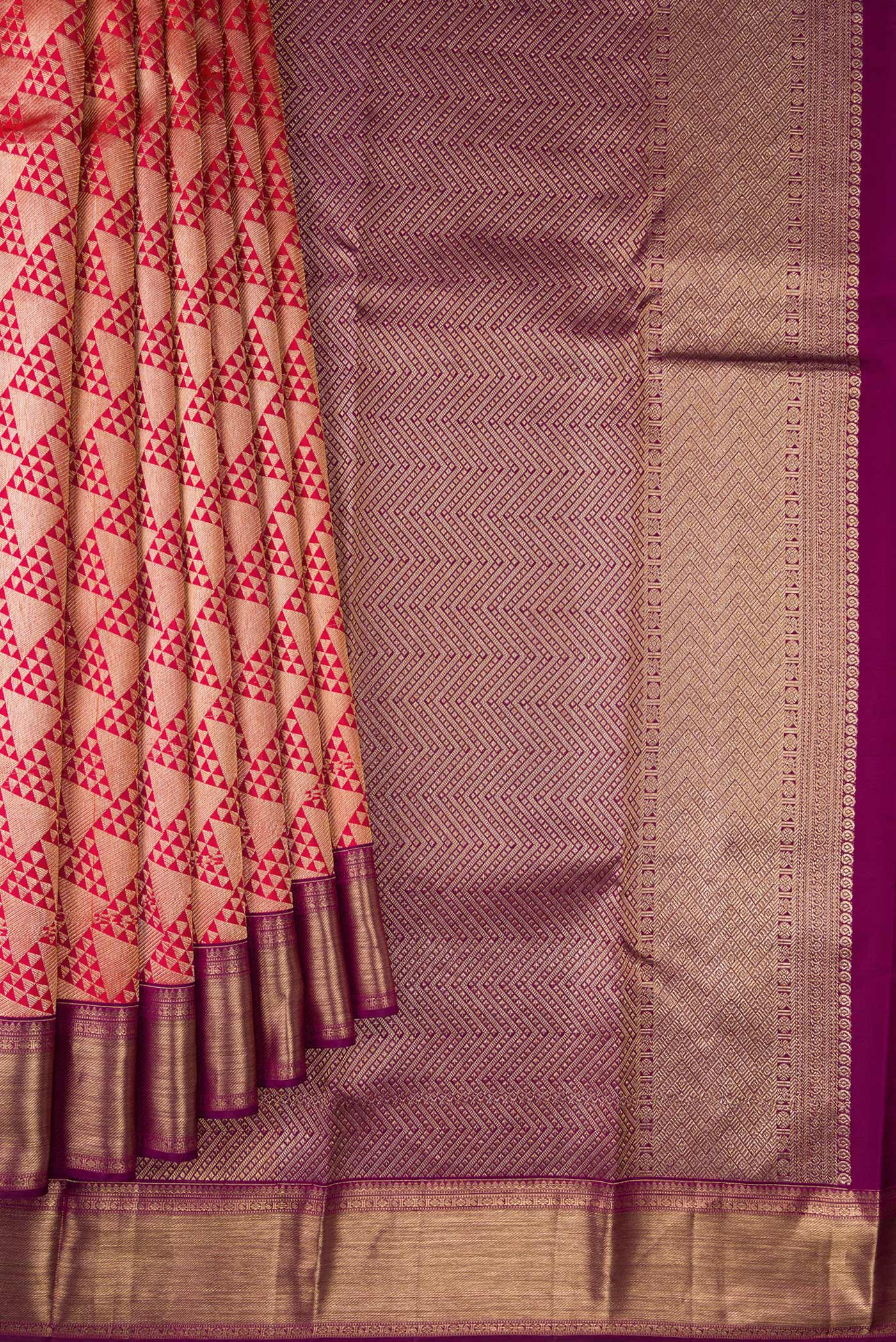 Pleats and pallu of Red Dual Tone Kanchipuram Silk Saree with Zari Brocade on the body and Zari Border. 
