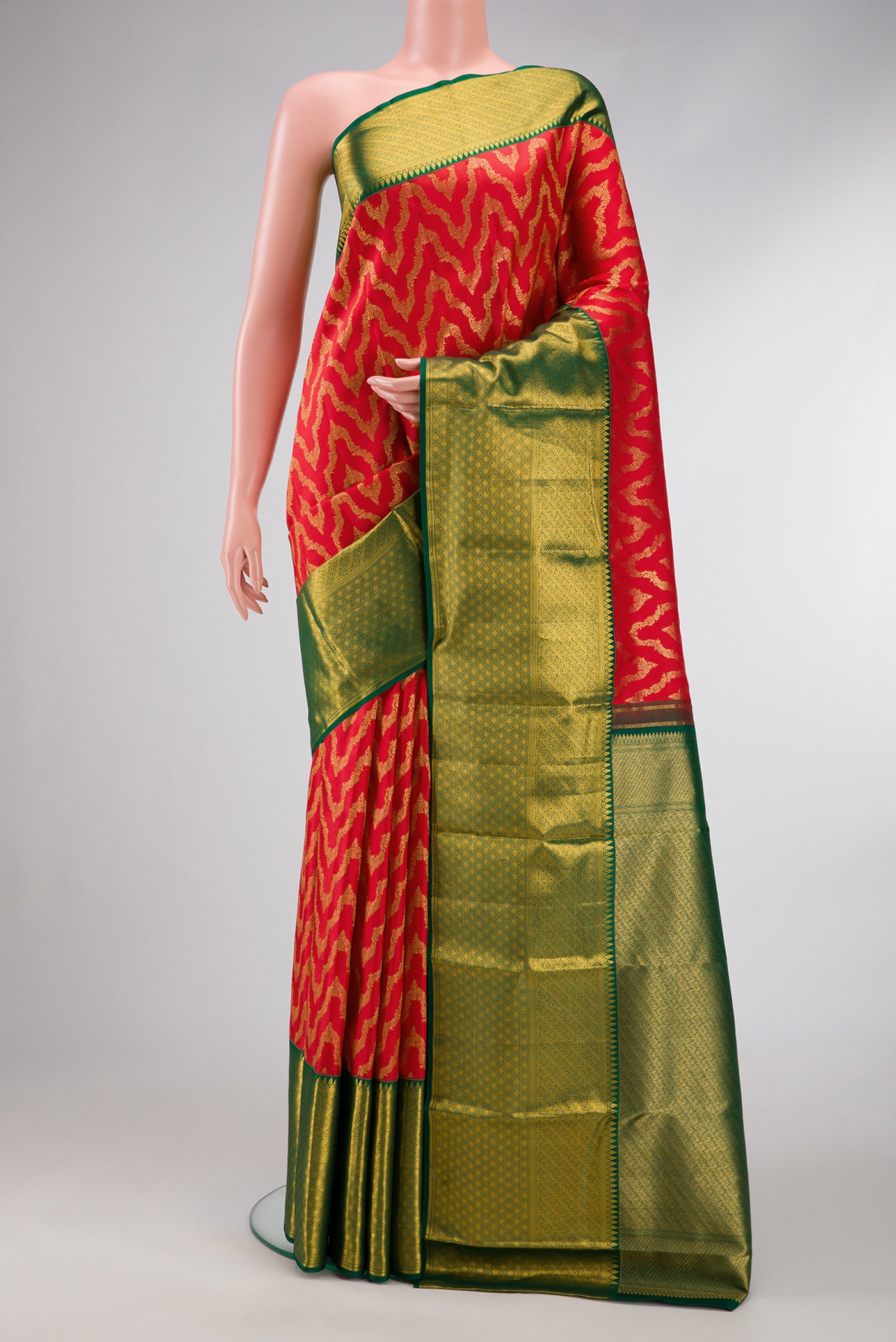Red Dual Tone Kanchipuram Silk Saree with Zari Brocade on the body and Zari Border.  displayed on a mannequin