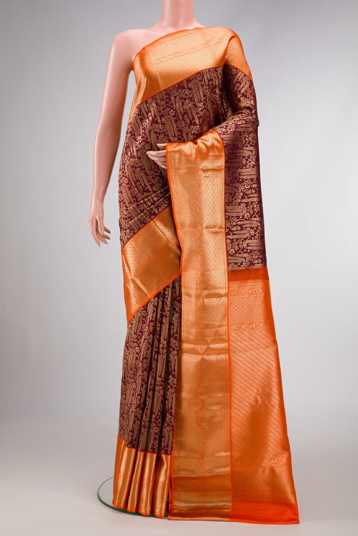 Brown Dual Tone Kanchipuram Silk Saree with Zari Brocade on the body and Zari Border.  displayed on a mannequin