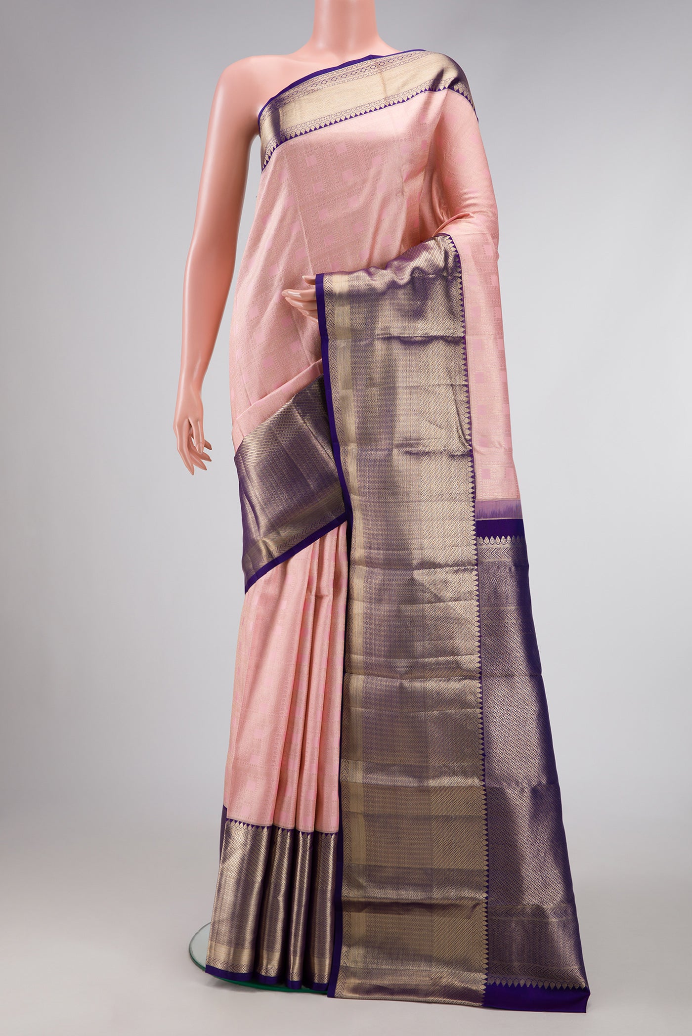 Pink Dual Tone Kanchipuram Silk Saree with Zari Brocade on the body and Zari Border.  displayed on a mannequin