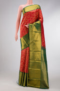Red Dual Tone Kanchipuram Silk Saree with Zari Brocade on the body and Zari Border.  displayed on a mannequin