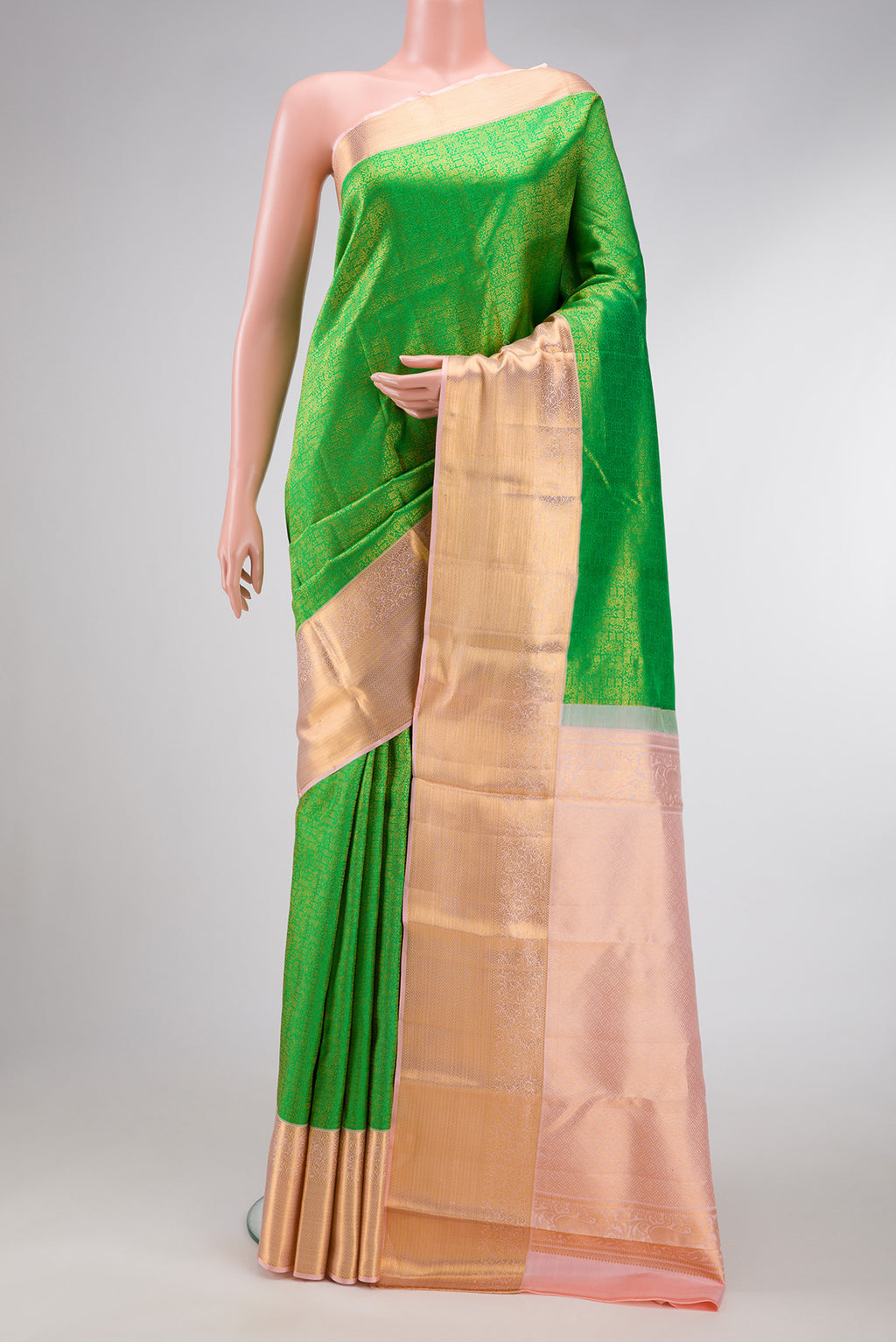 Parrot Green Dual Tone Kanchipuram Silk Saree with Zari Brocade on the body and Zari Border.  displayed on a mannequin
