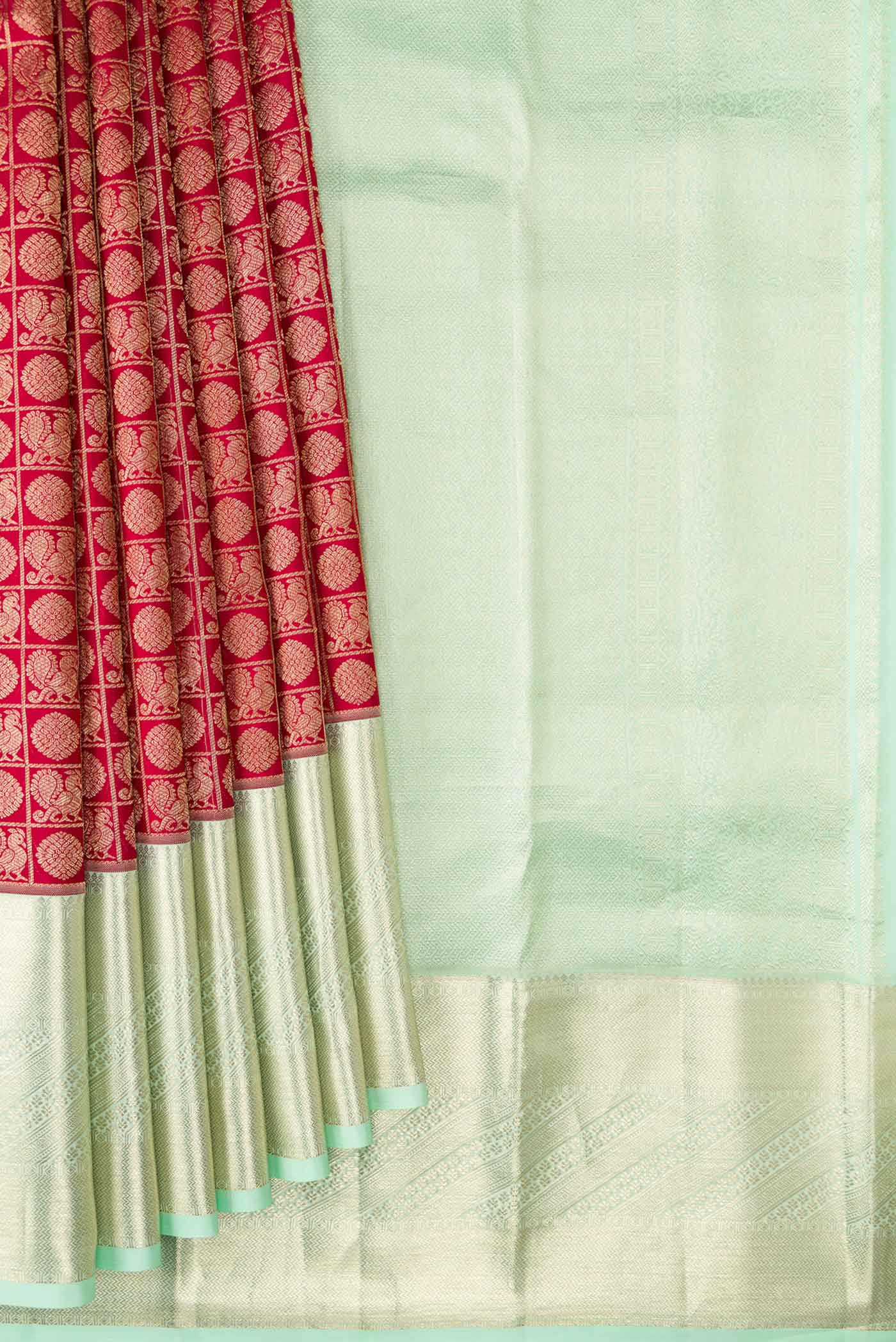 Pleats and pallu of Maroon Dual Tone Kanchipuram Silk Saree with Zari Brocade on the body and Zari Border. 