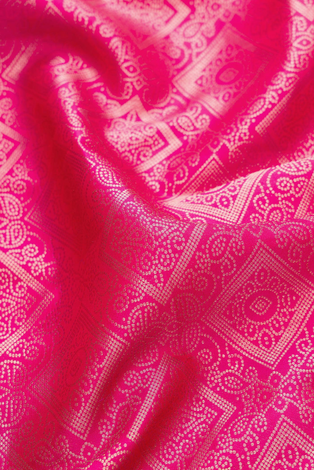 Close up of Pink Dual Tone Kanjivaram Silk Saree with Zari Brocade on the body and Zari Border.  displaying folds