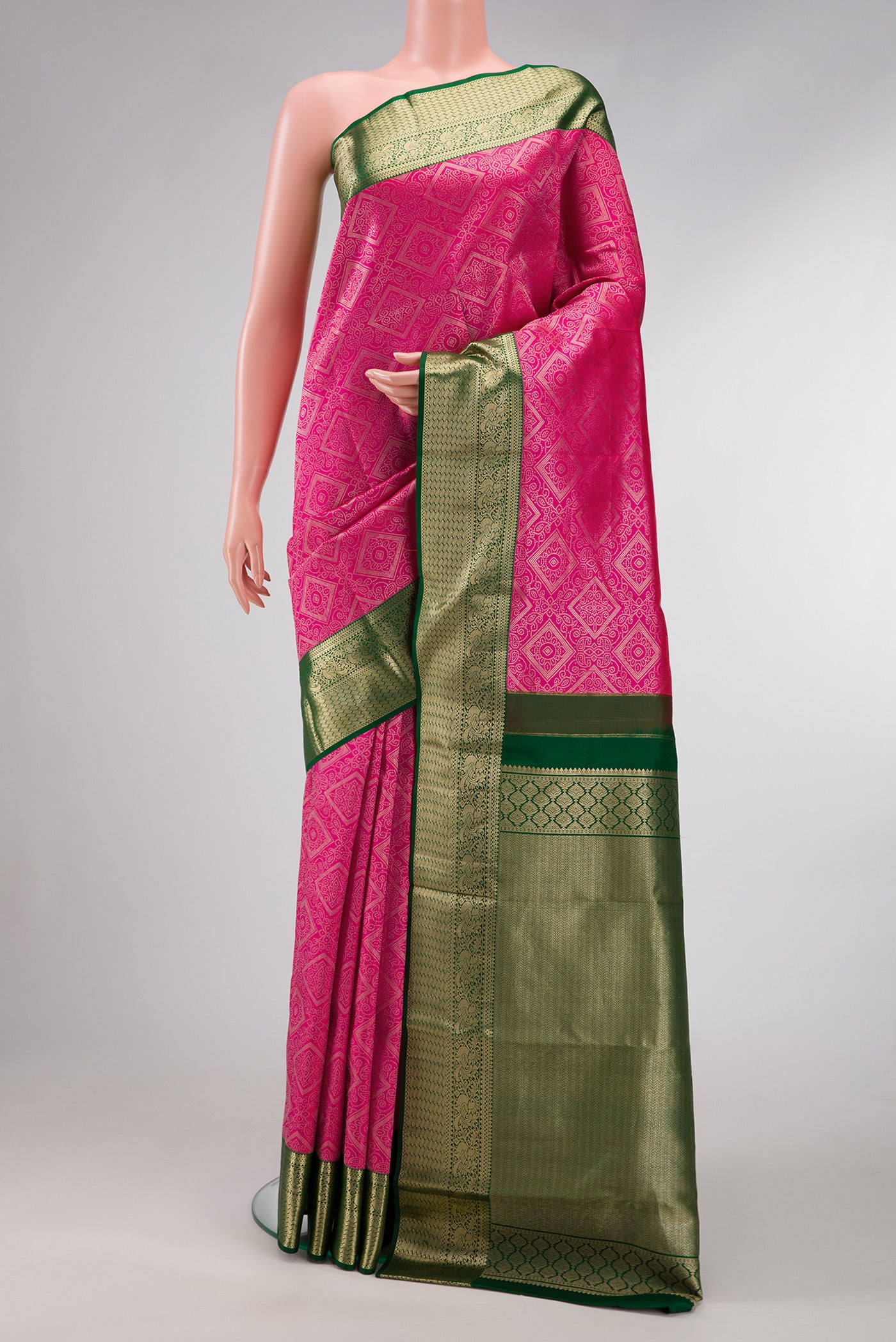 Pink Dual Tone Kanjivaram Silk Saree with Zari Brocade on the body and Zari Border.  displayed on a mannequin