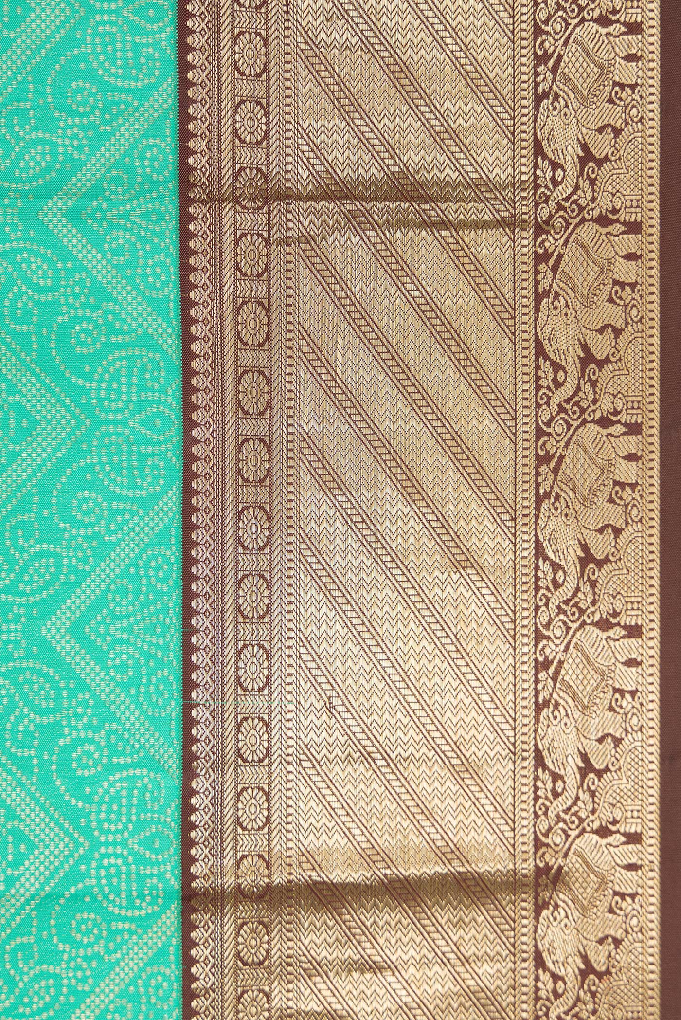 Border image of Sea Green Dual Tone Kanjivaram Silk Saree with Zari Brocade on the body and Zari Border. 