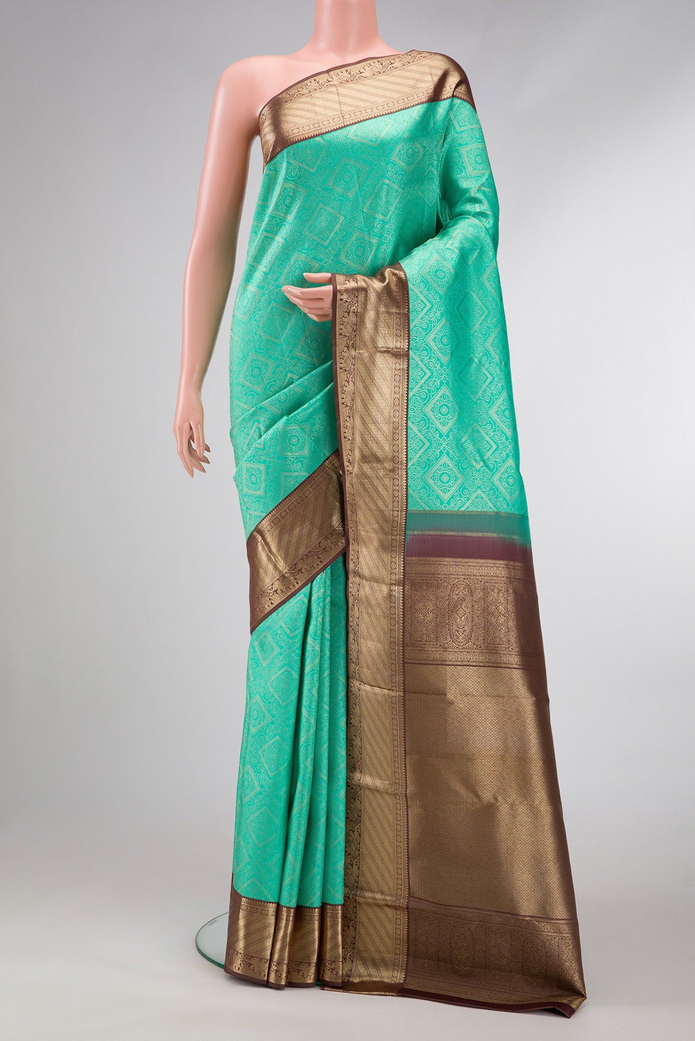 Sea Green Dual Tone Kanjivaram Silk Saree with Zari Brocade on the body and Zari Border.  displayed on a mannequin