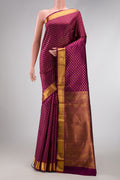 Magenta Dual Tone Kanjivaram Silk Saree with Zari Brocade on the body and Zari Border.  displayed on a mannequin