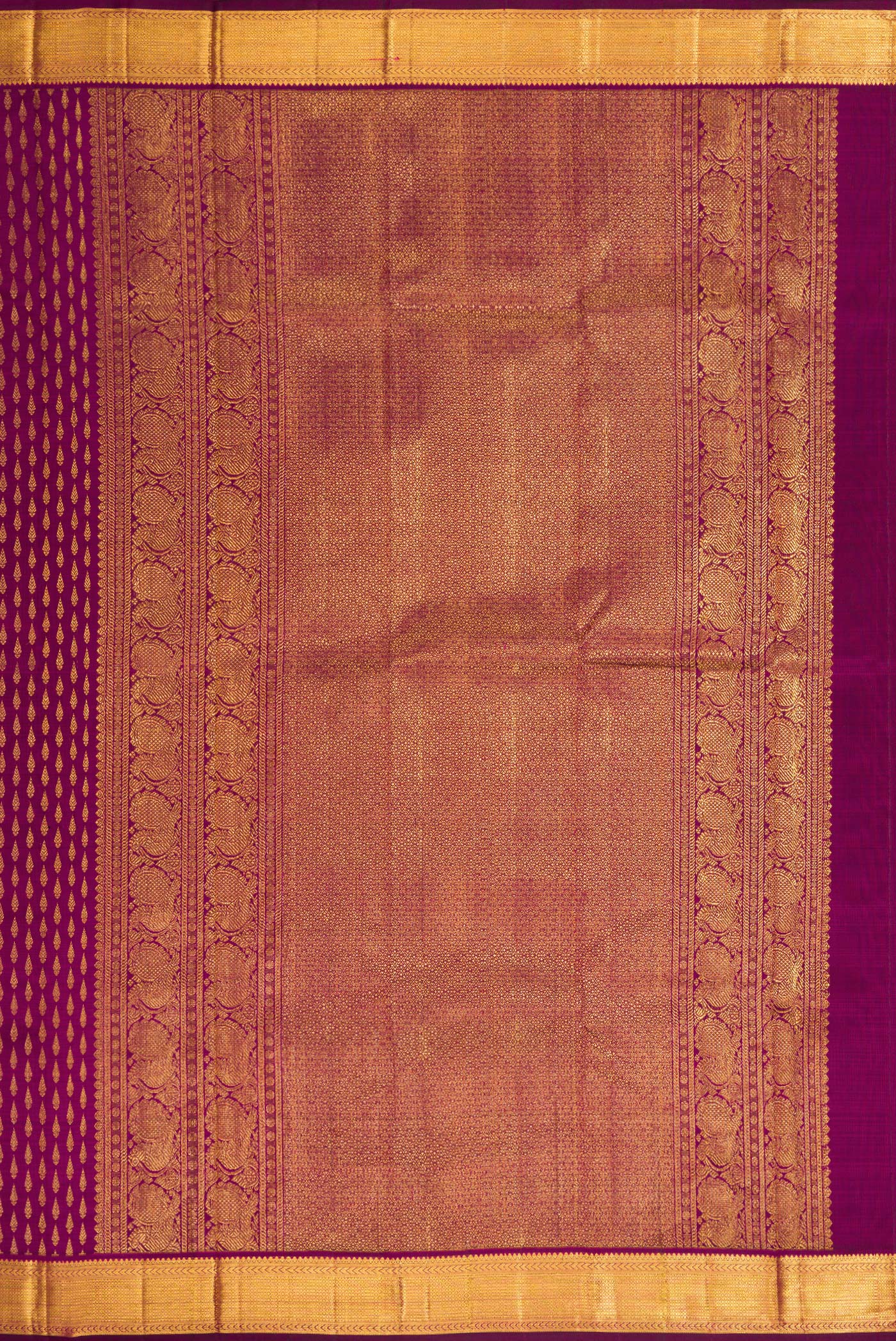 Close up image of the pallu of Magenta Dual Tone Kanjivaram Silk Saree with Zari Brocade on the body and Zari Border. 