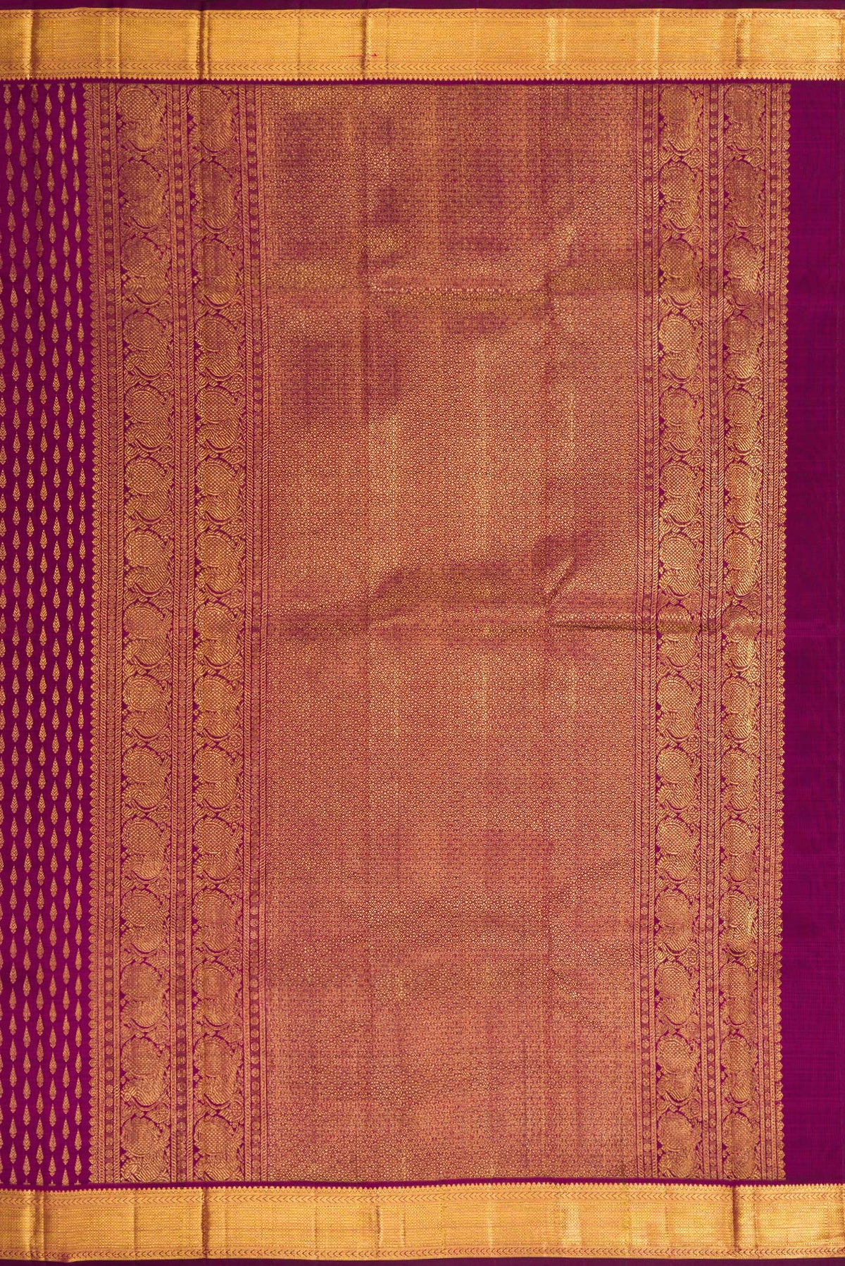 Close up image of the pallu of Magenta Dual Tone Kanjivaram Silk Saree with Zari Brocade on the body and Zari Border. 