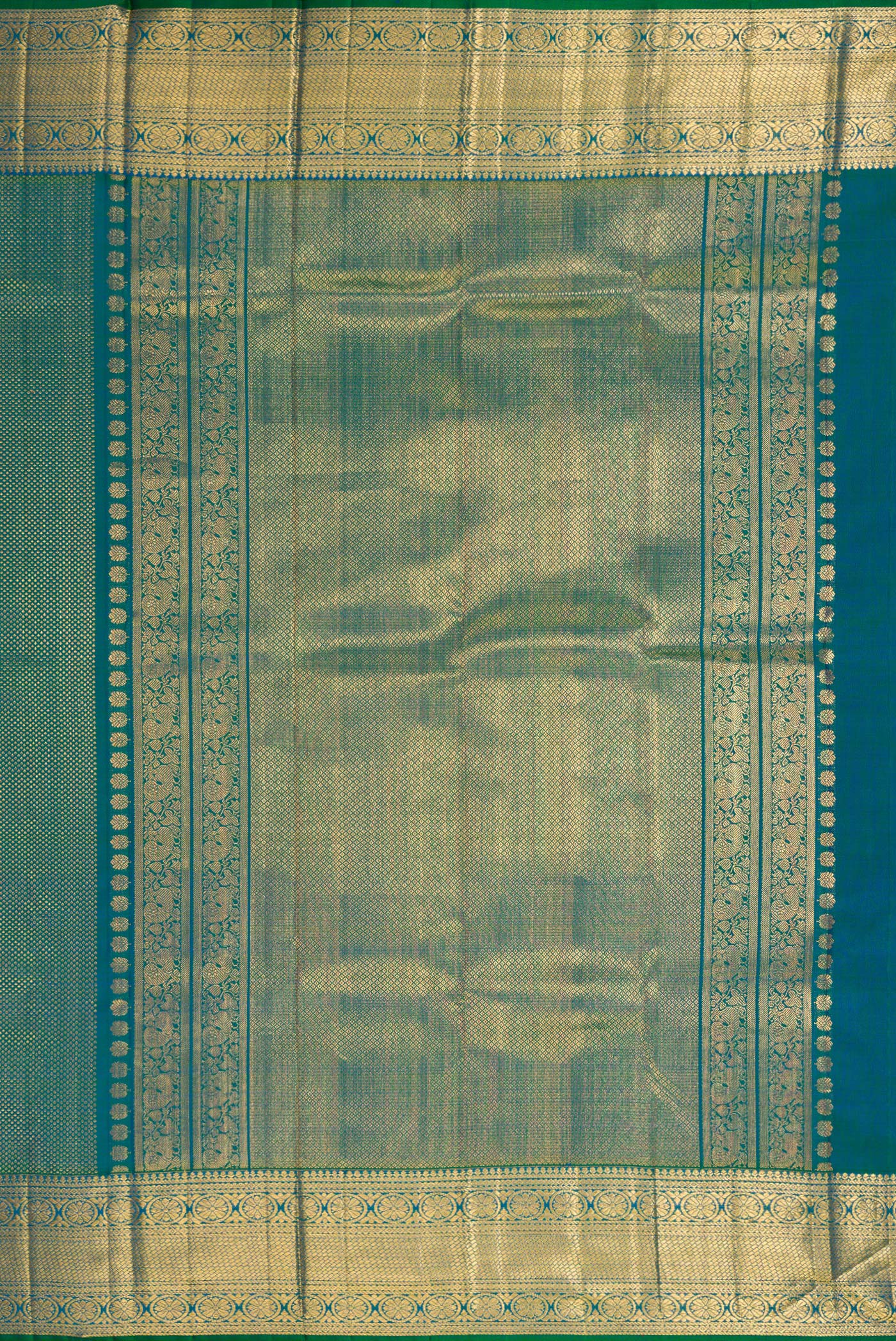 Close up image of the pallu of Peacock Blue Dual Tone Kanchipuram Silk Saree with Zari Brocade on the body and Zari Border. 
