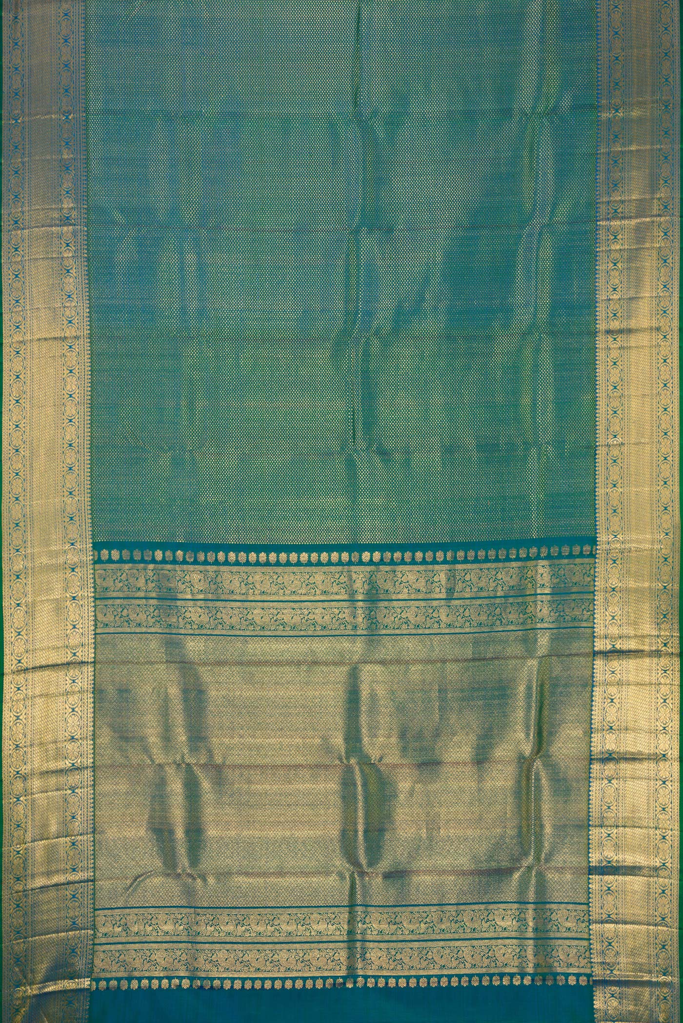 Flat view of Peacock Blue Dual Tone Kanchipuram Silk Saree with Zari Brocade on the body and Zari Border. 