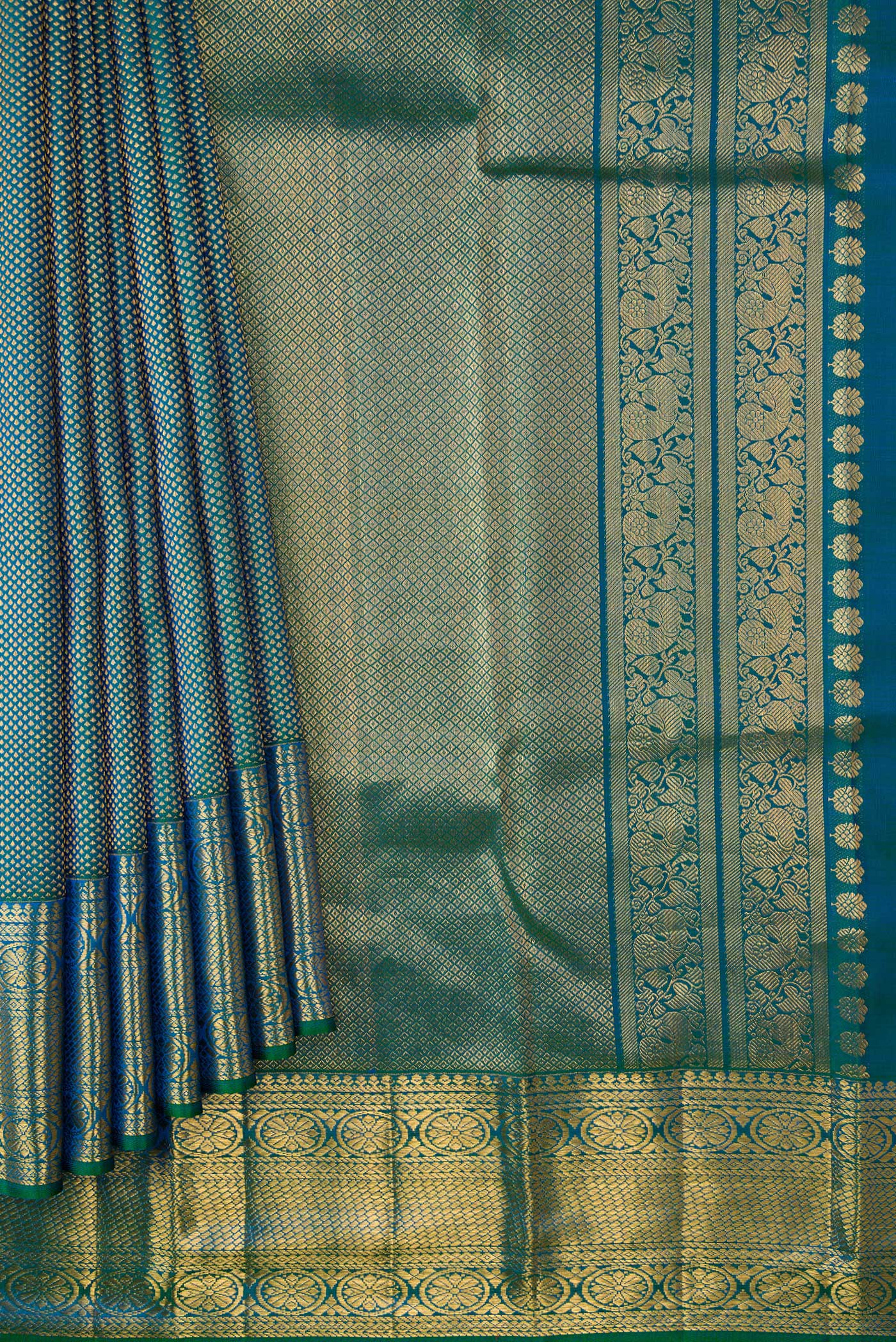 Pleats and pallu of Peacock Blue Dual Tone Kanchipuram Silk Saree with Zari Brocade on the body and Zari Border. 