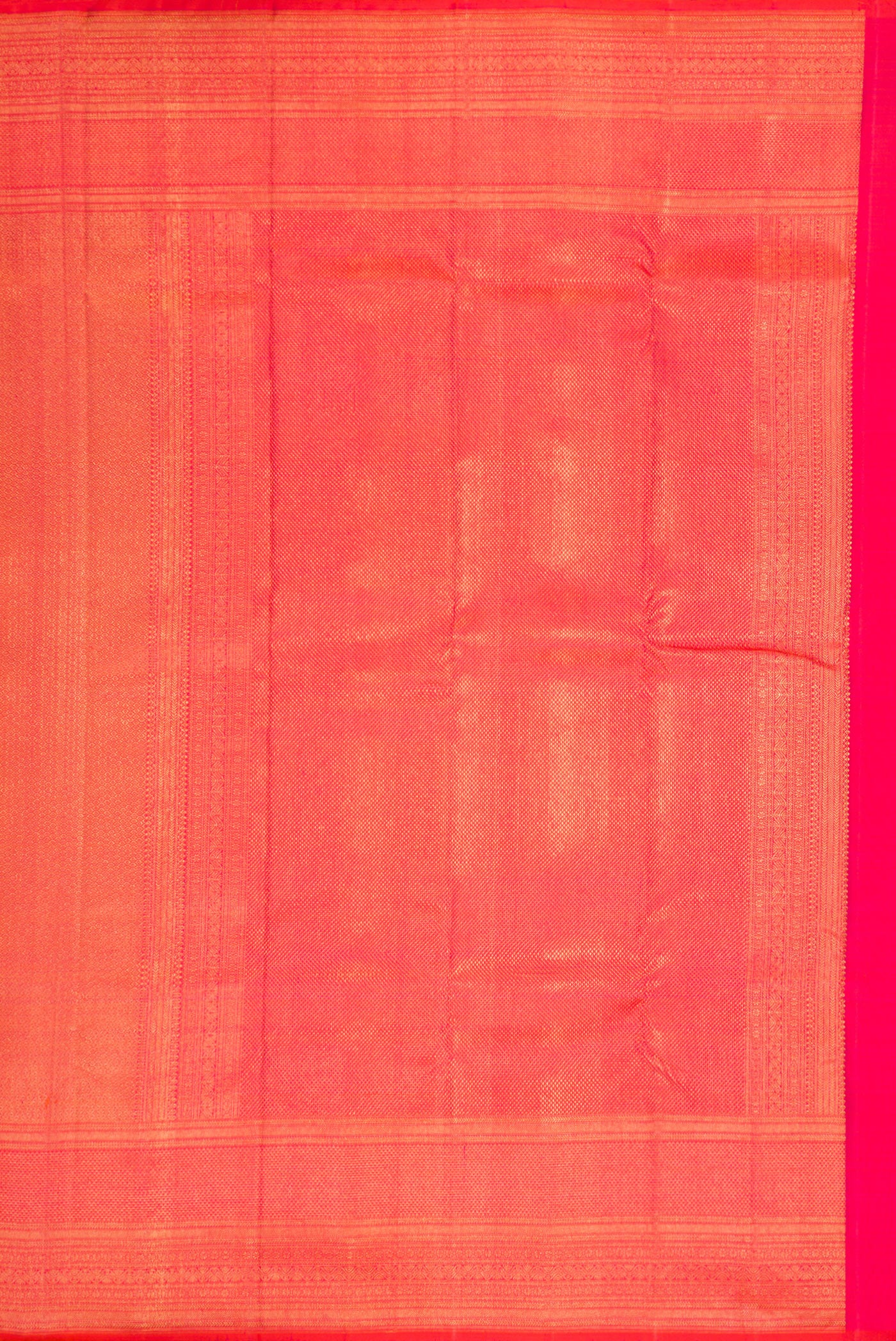 Close up image of the pallu of Coral Dual Tone Kanchipuram Silk Saree with Zari Brocade on the body and Zari Border. 