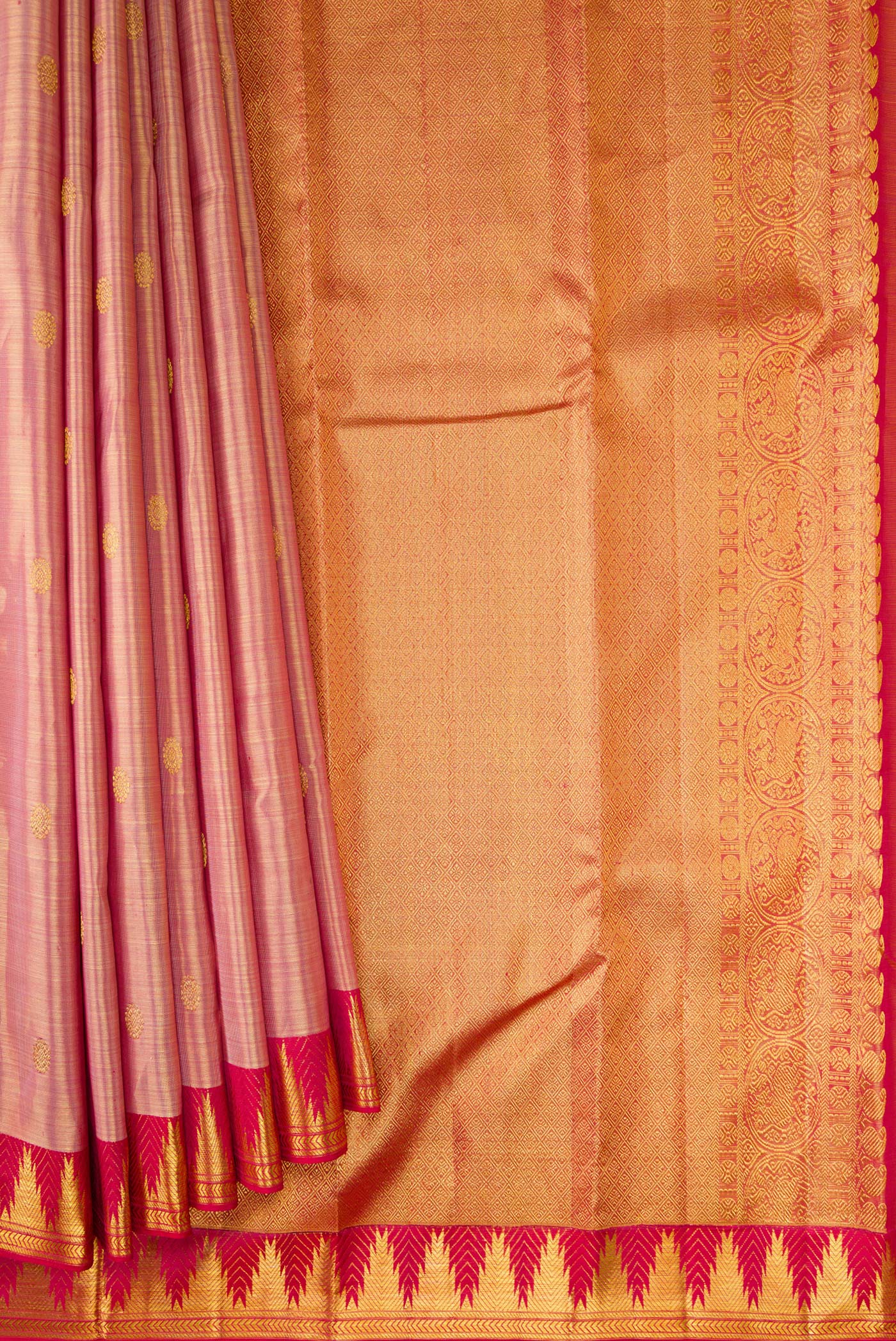 Pleats and pallu of Rose Gold Dual Tone Kanchipuram Tissue Silk Saree with Zari Brocade on the body and Zari Border. 