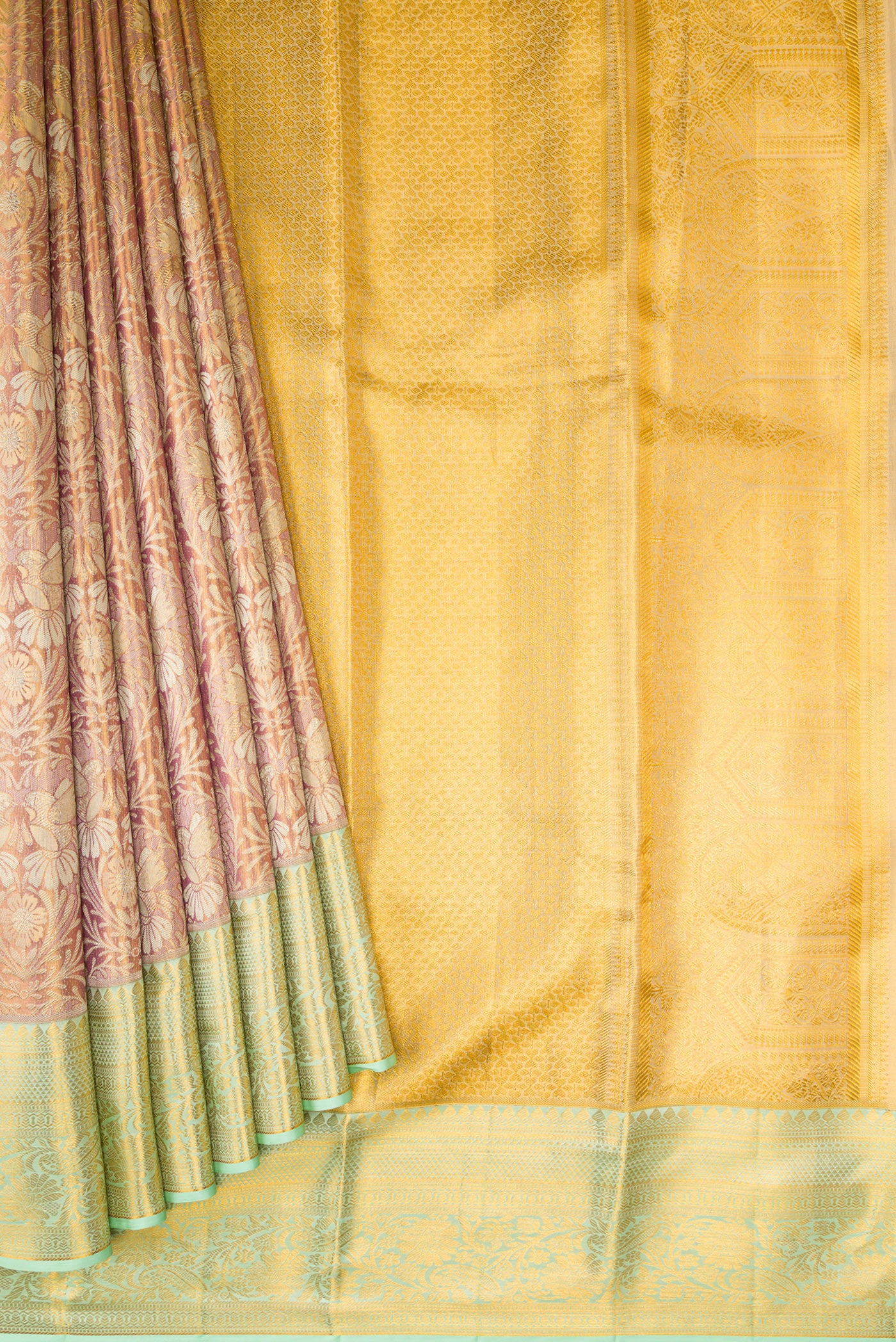 Pleats and pallu of Rose Gold Dual Tone Kanchipuram Tissue Silk Saree with Zari Brocade on the body and Zari Border. 