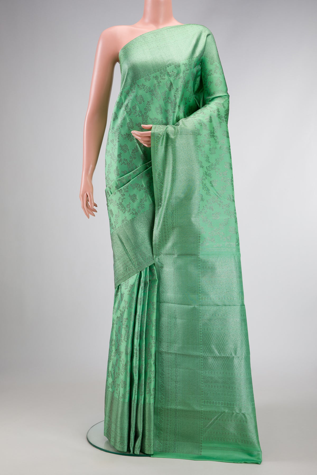 Pista Green Dual Tone Kanjivaram Silk Saree with Zari Brocade on the body and Zari Border.  displayed on a mannequin