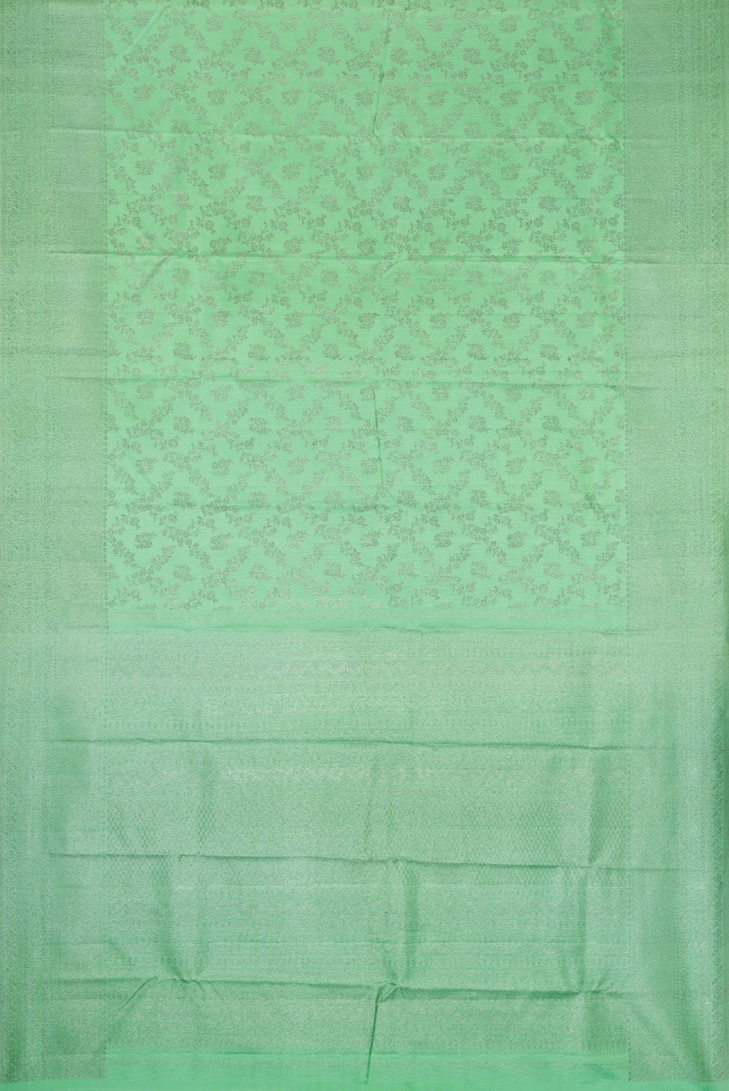 Flat view of Pista Green Dual Tone Kanjivaram Silk Saree with Zari Brocade on the body and Zari Border. 