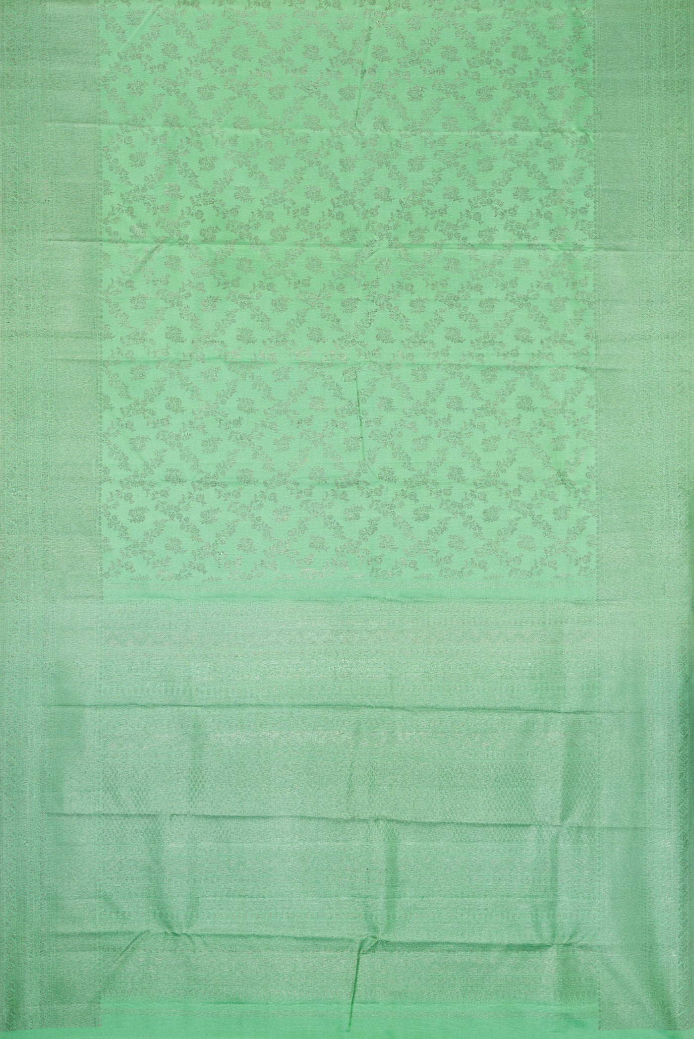 Flat view of Pista Green Dual Tone Kanjivaram Silk Saree with Zari Brocade on the body and Zari Border. 