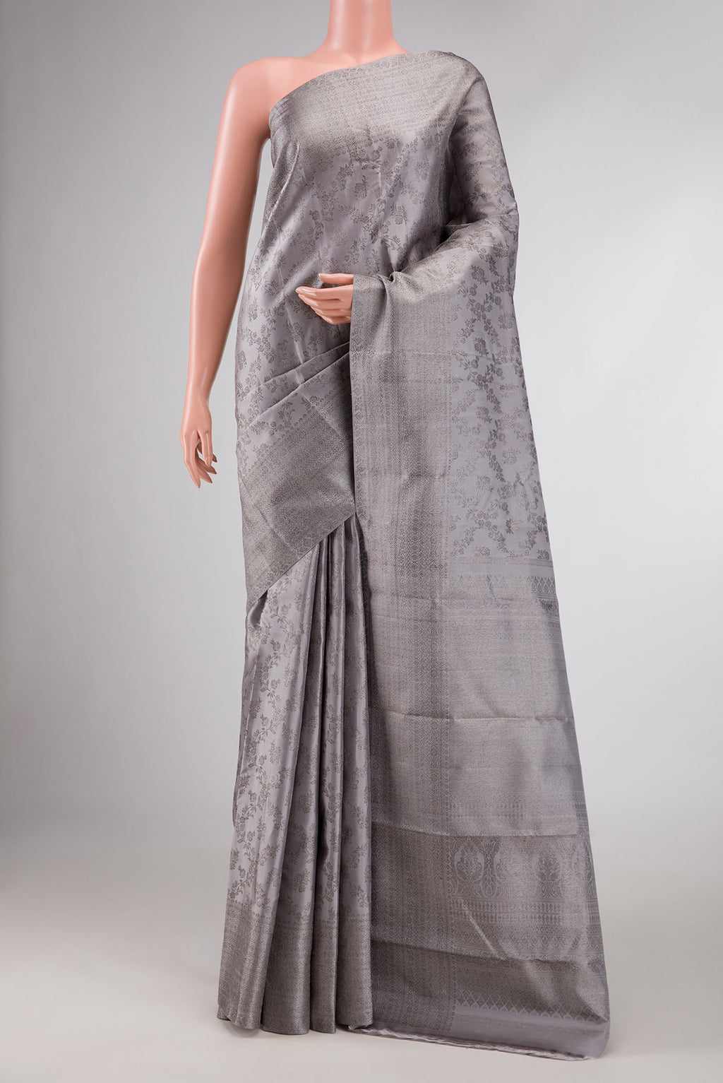 Grey Dual Tone Kanchipuram Silk Saree with Zari Brocade on the body and Zari Border displayed on a mannequin