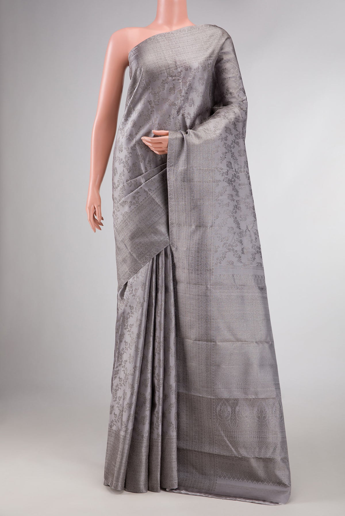 Grey Dual Tone Kanchipuram Silk Saree with Zari Brocade on the body and Zari Border displayed on a mannequin
