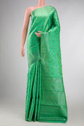 Green Dual Tone Kanchipuram Silk Saree with Zari Brocade on the body and Zari Border displayed on a mannequin