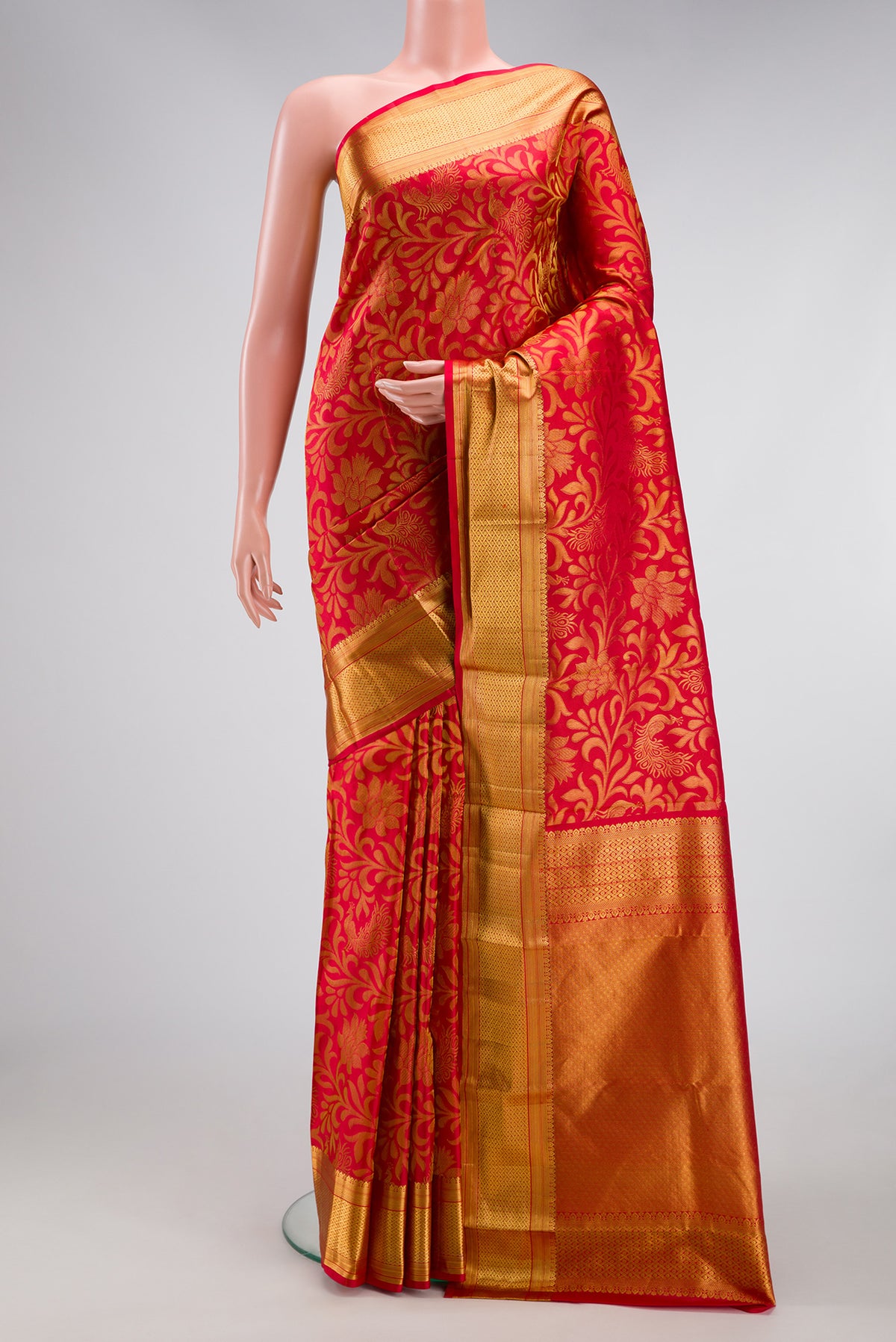 Dark Pink Dual Tone Kanchipuram Silk Saree with Zari Brocade on the body and Zari Border.  displayed on a mannequin