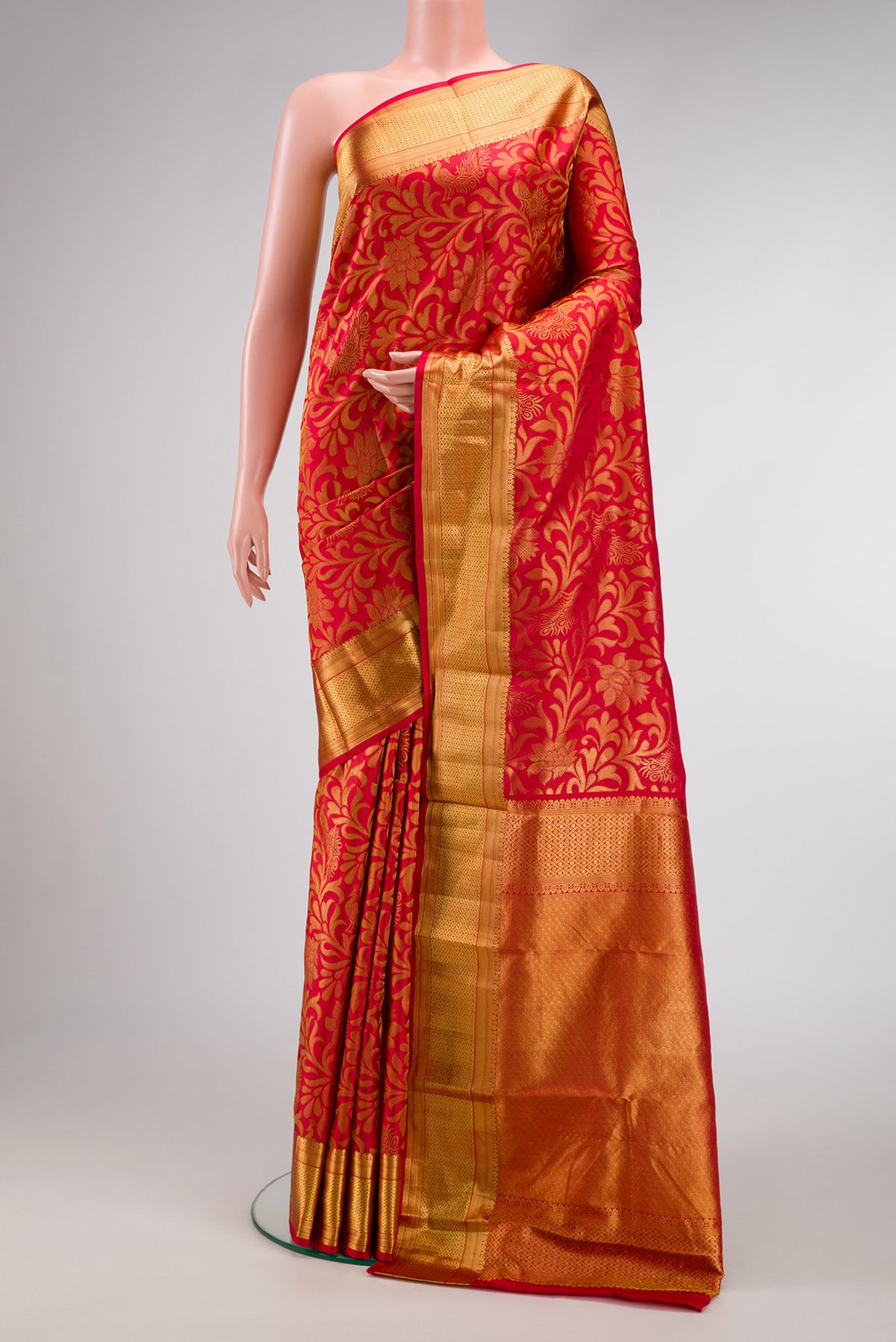 Red Dual Tone Kanchipuram Silk Saree with Zari Brocade on the body and Zari Border.  displayed on a mannequin