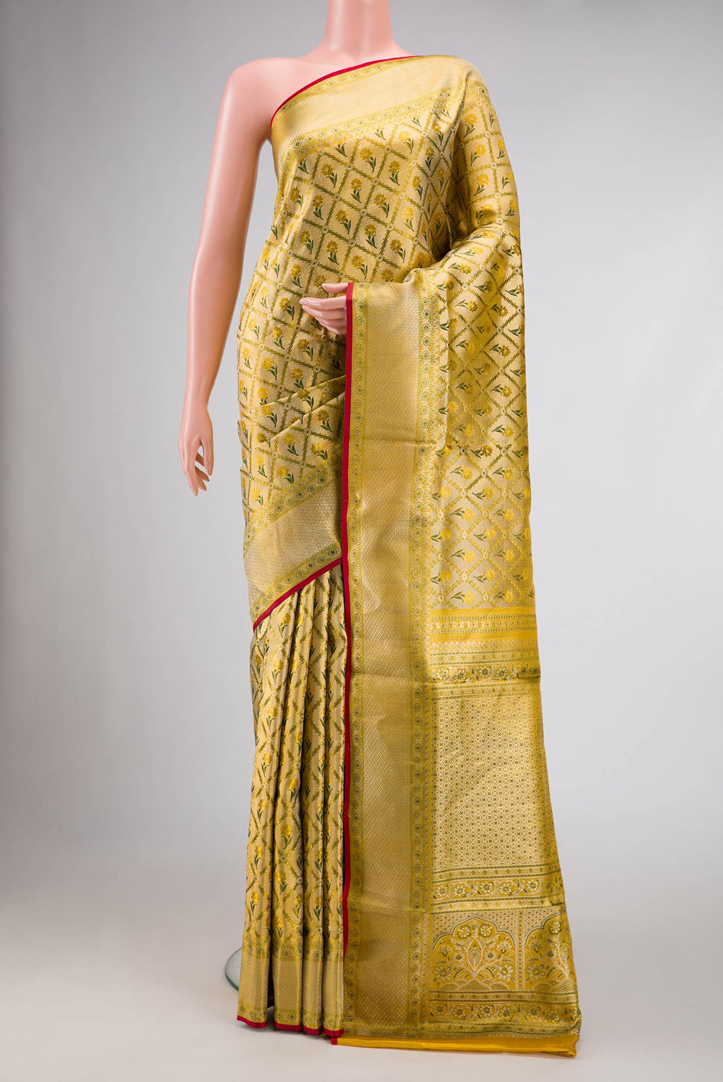 Gold Dual Tone Kanjivaram Tissue Silk Saree with Zari Brocade on the body and Zari Border.  displayed on a mannequin