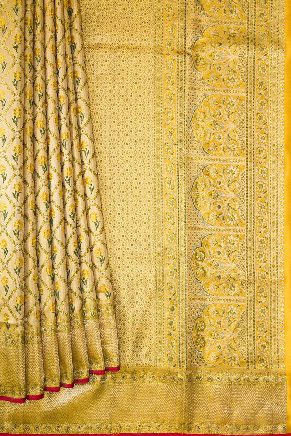 Pleats and pallu of Gold Dual Tone Kanjivaram Tissue Silk Saree with Zari Brocade on the body and Zari Border. 