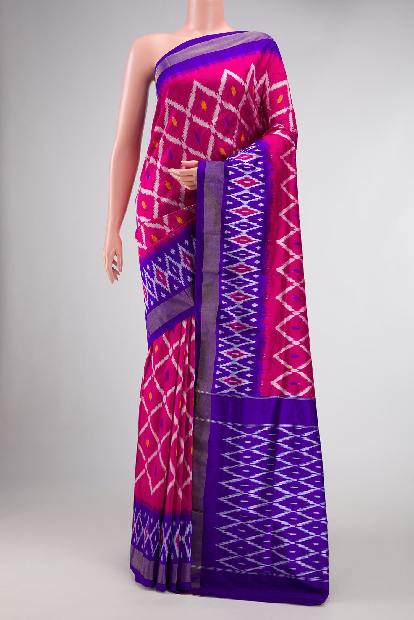 Pink Dual Tone Double Ikat Saree with Ikat Print on the body and Ikat Border.  displayed on a mannequin