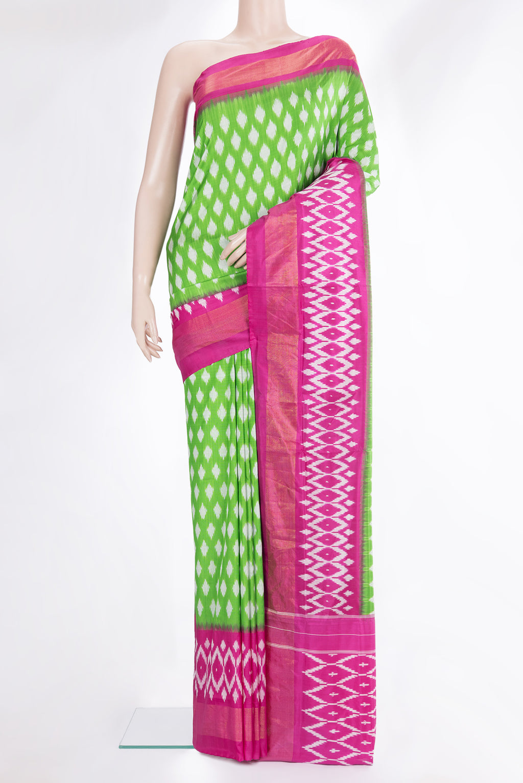 Pure Silk Parrot Green Dual Tone Pochampally Saree with Ikat design on the body and Ikat Border.  displayed on a mannequin