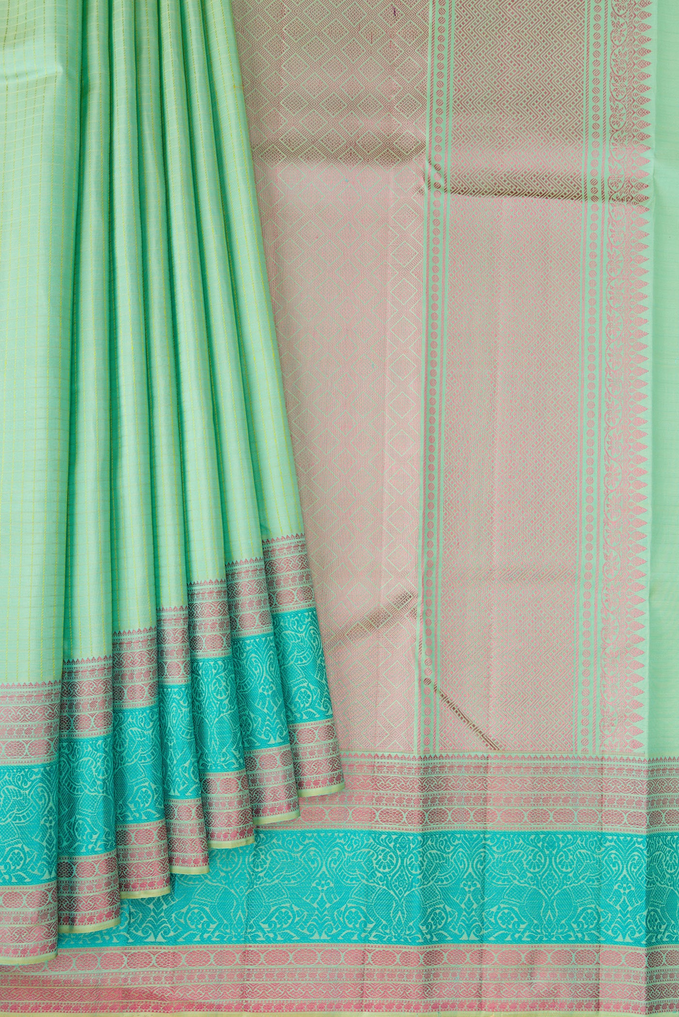 Pleats and pallu of Mint Green Kanchipuram Silk Saree with Checked design on the body and Thread Border. 