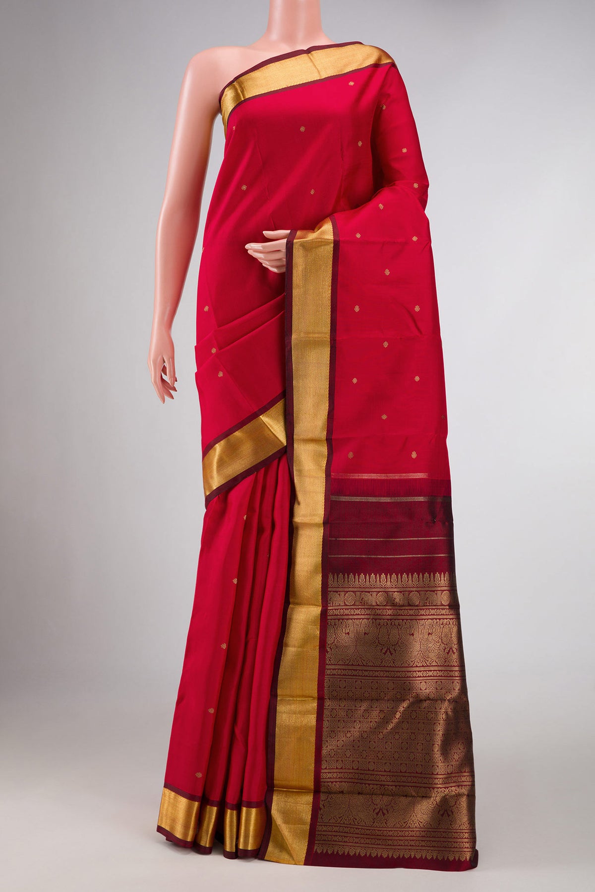 Pure Silk Pure Zari Pink Kanchipuram Saree with Zari Butta on the body and Zari Border displayed on a mannequin