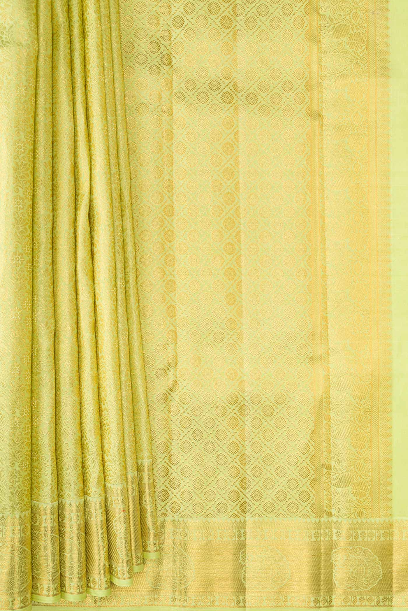 Pleats and pallu of Parrot Green Dual Tone Kanchipuram Silk Saree with Zari Brocade on the body and Zari Border. 