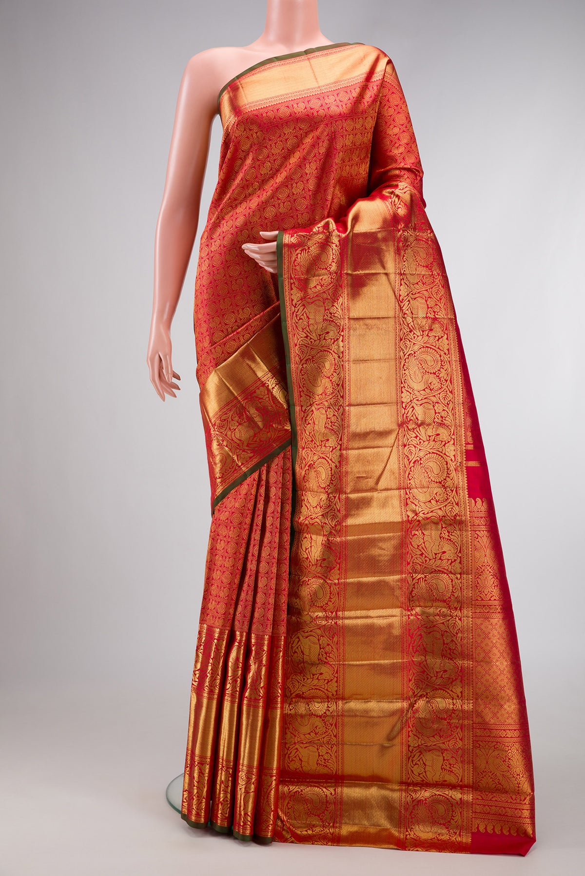 Pure Silk Pure Zari Maroon Dual Tone Kanjivaram Saree with Zari Brocade on the body and Fancy Border.  displayed on a mannequin