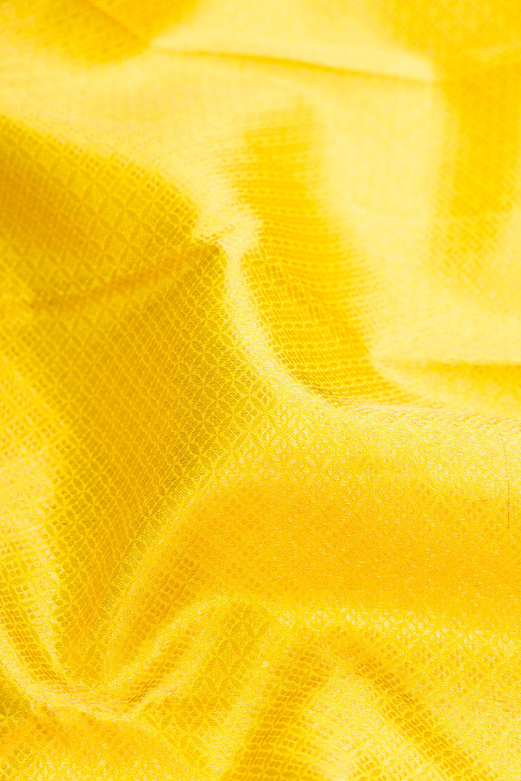 Close up of Pure Silk Pure Zari Yellow Dual Tone Kanjivaram Saree with Zari Brocade on the body and Zari Border.  displaying folds