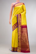 Pure Silk Pure Zari Yellow Dual Tone Kanjivaram Saree with Zari Brocade on the body and Zari Border.  displayed on a mannequin