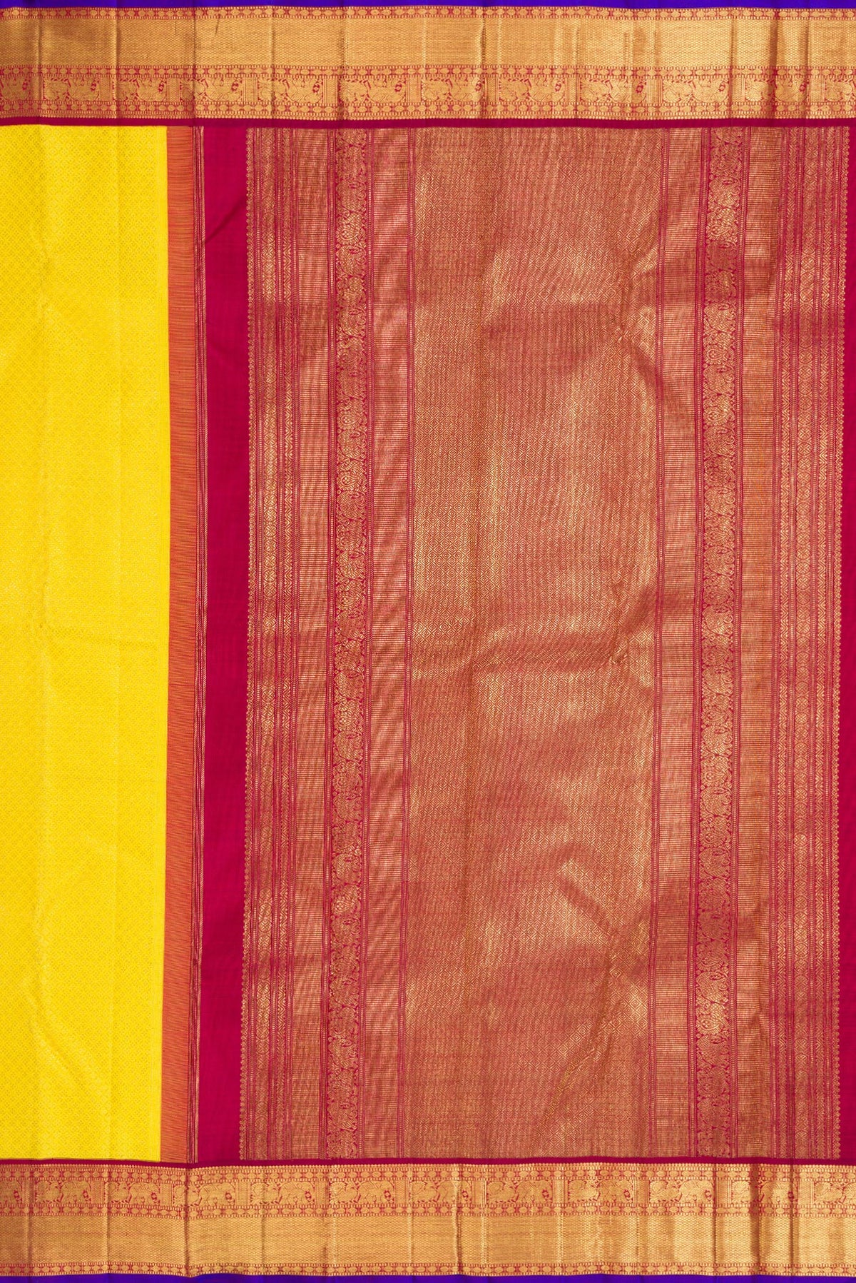 Close up image of the pallu of Pure Silk Pure Zari Yellow Dual Tone Kanjivaram Saree with Zari Brocade on the body and Zari Border. 